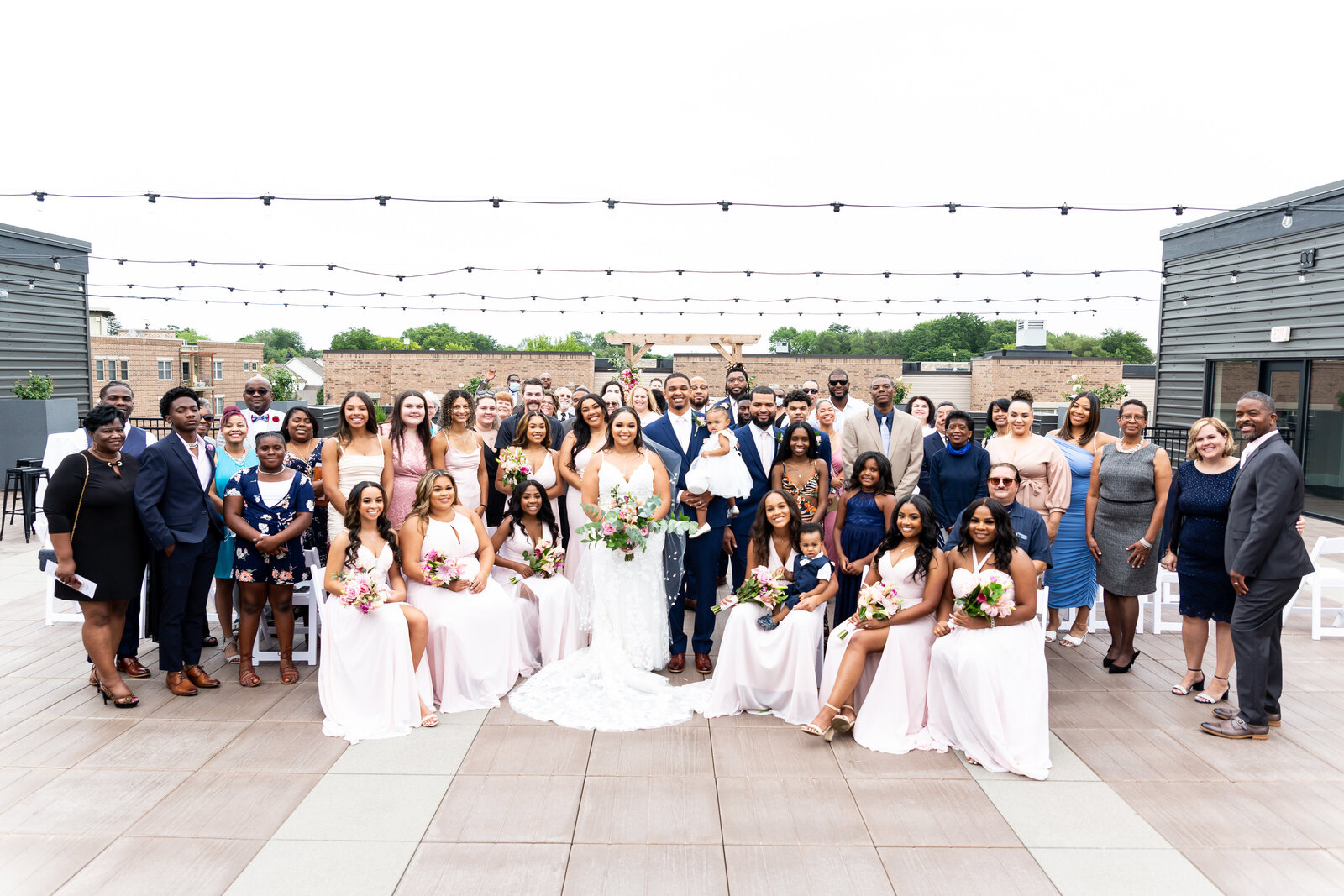 Large wedding party on a  rooftop