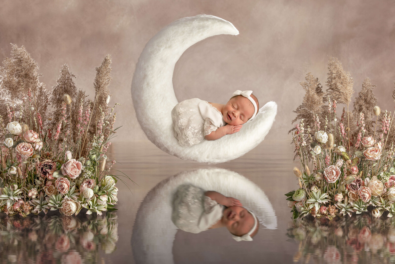 Newborn baby girl sleeping on a moon taken by Jen Sabatini Photography