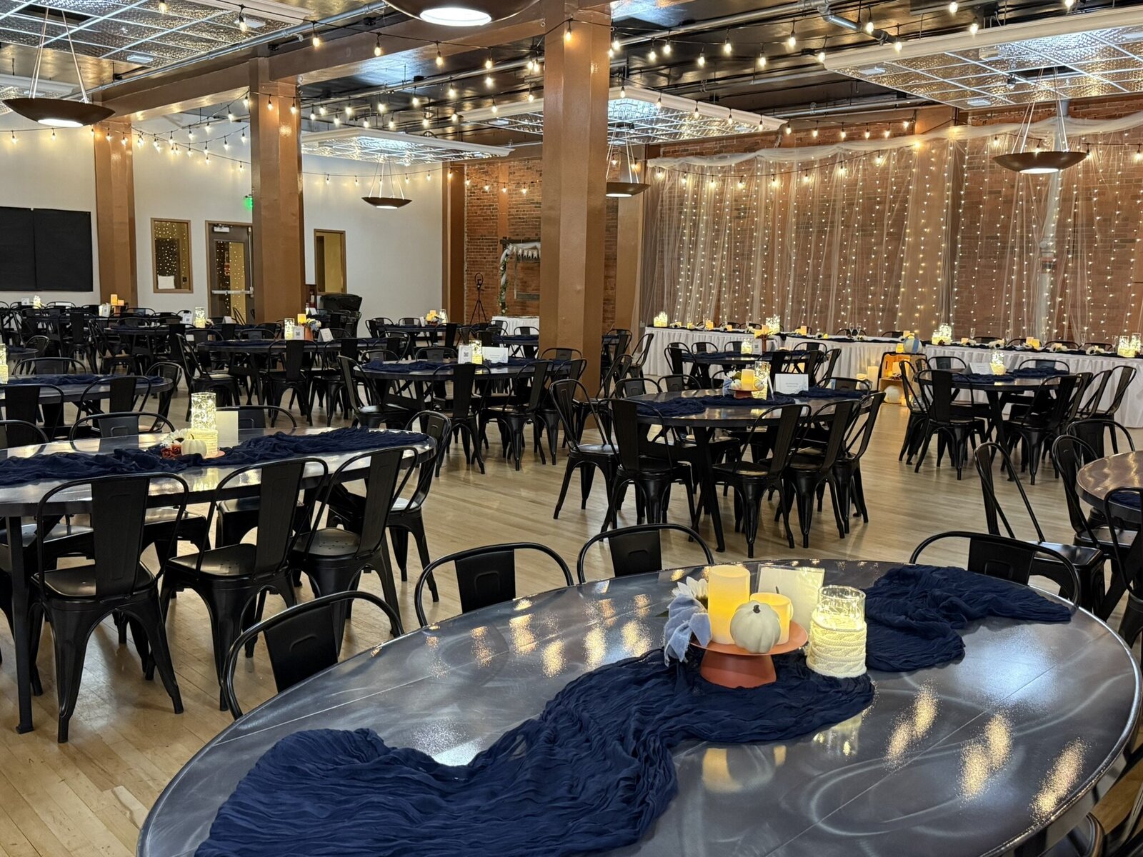 Rendezvous at 410 reception space with lots of elegant tables, chairs and decorations