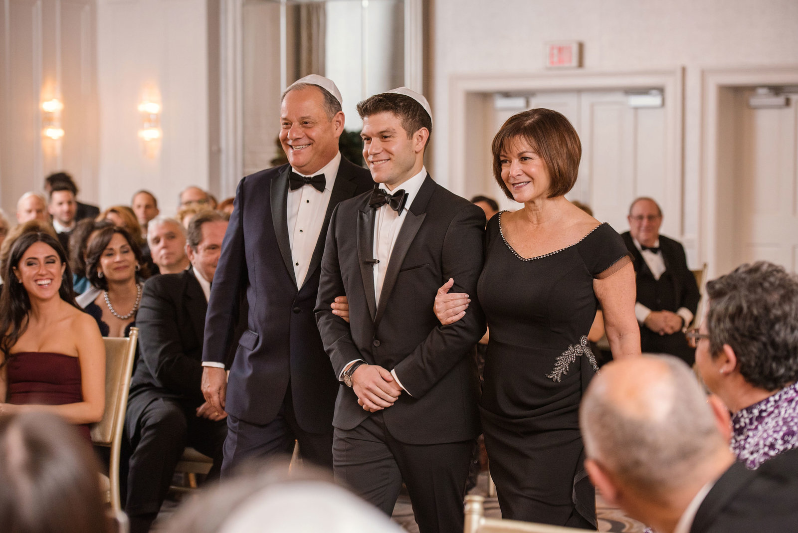 groom and parents walking down the aisle at Glen Head Country Club