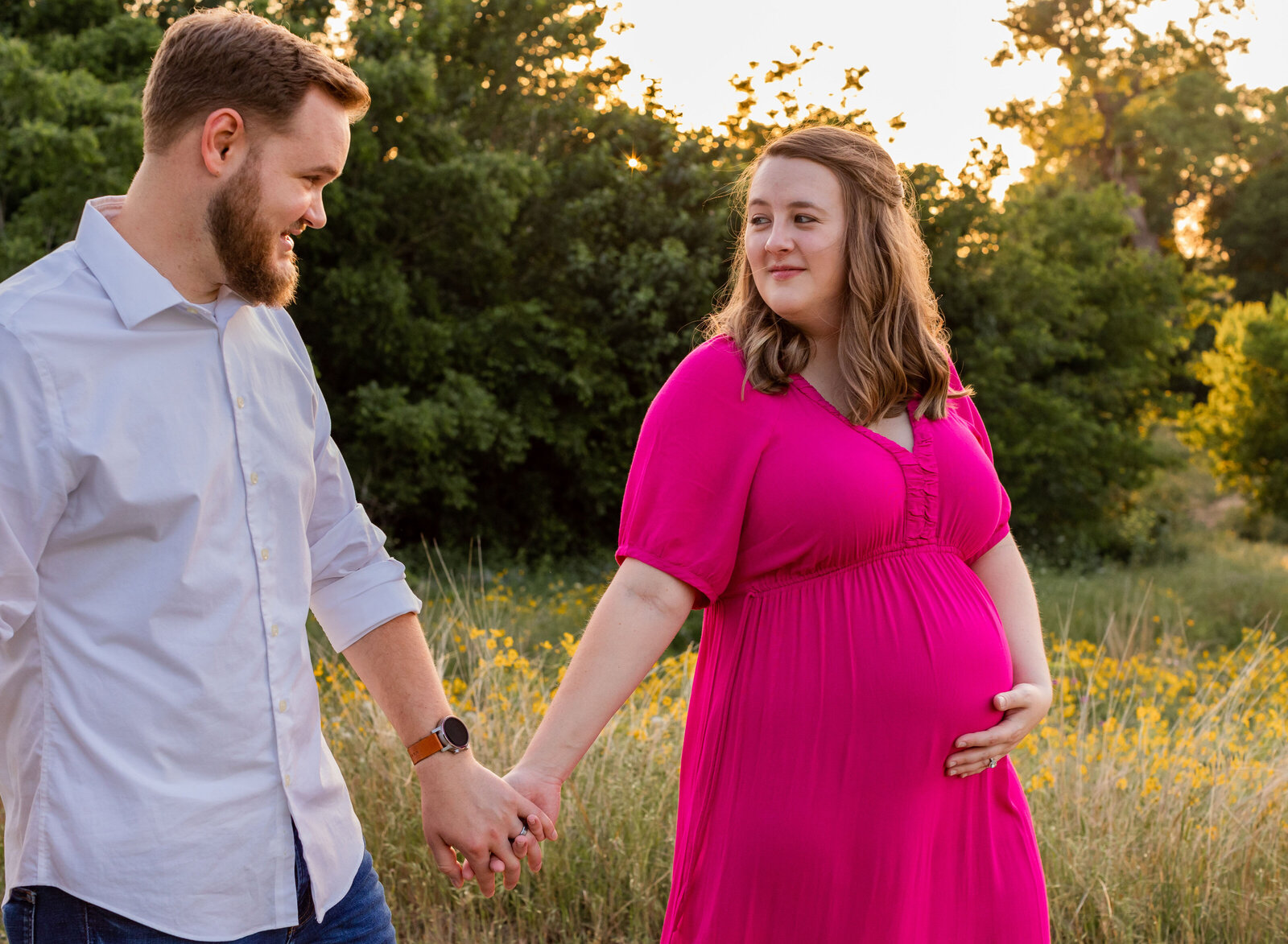 pregnant mom walking with dad