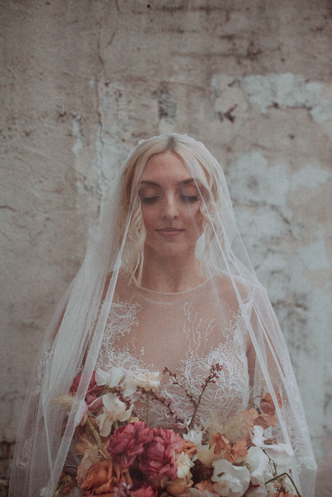 bride in gown with long veil