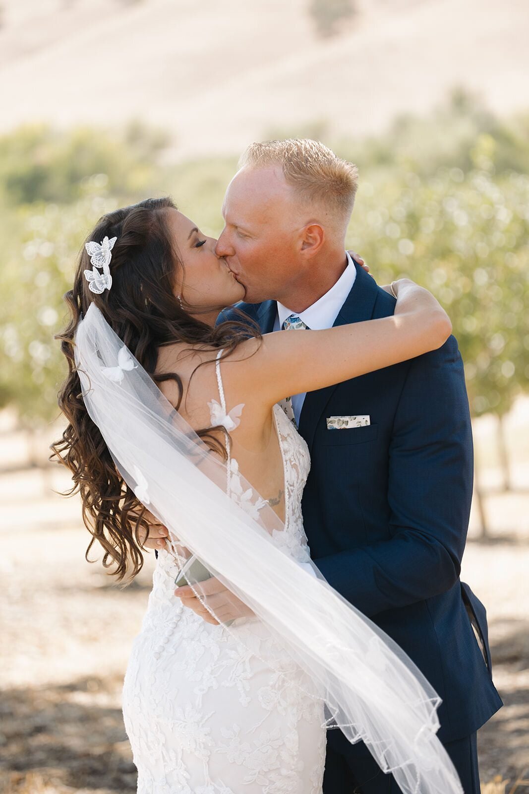 Bride and groom kissing during their first look