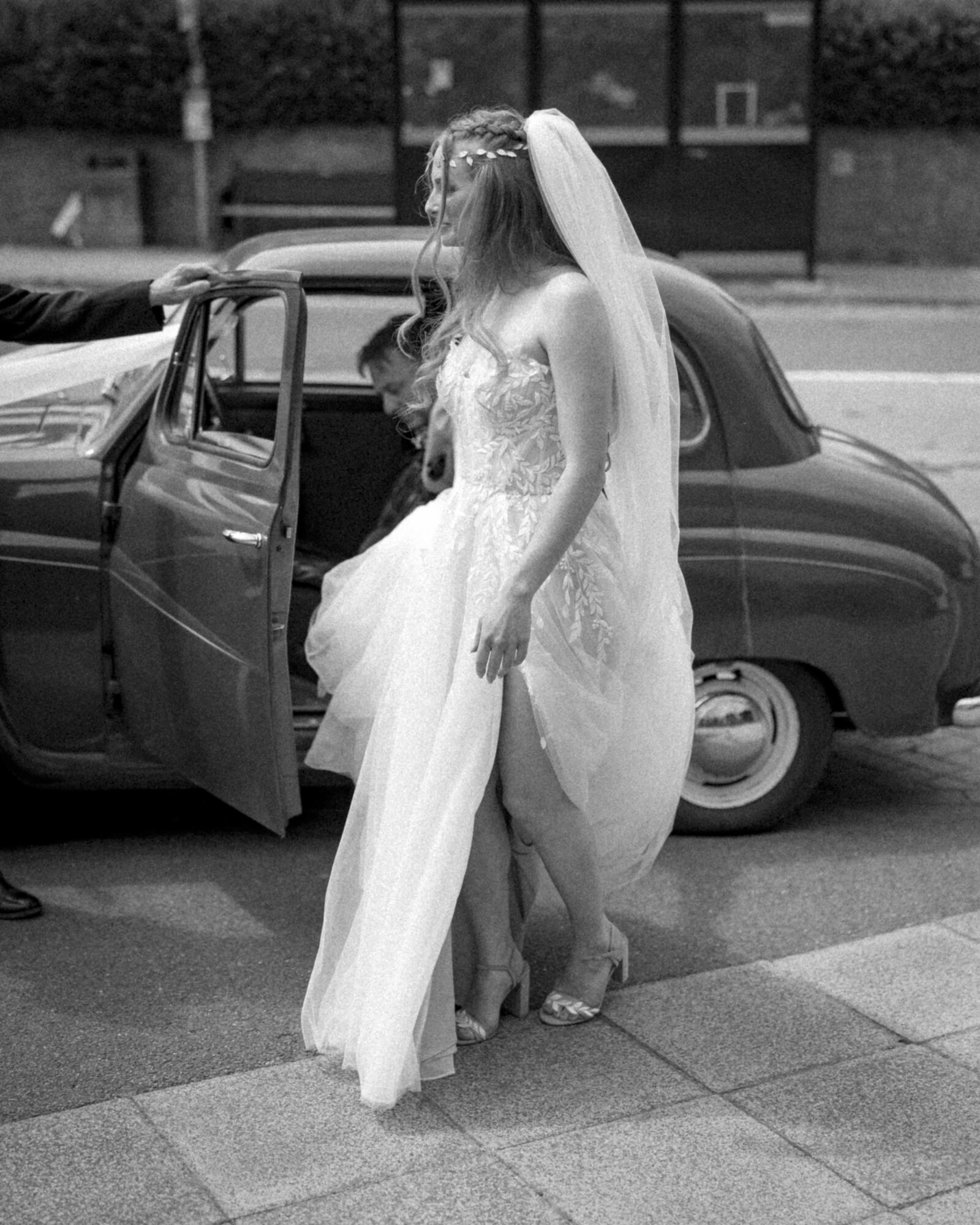 Black and white bride getting out of car