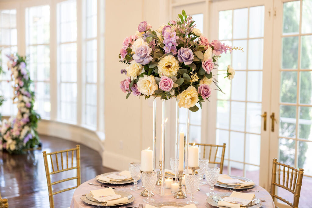An exquisite indoor wedding at a Central Florida estate, featuring opulent silk floral arrangements and  tablescape