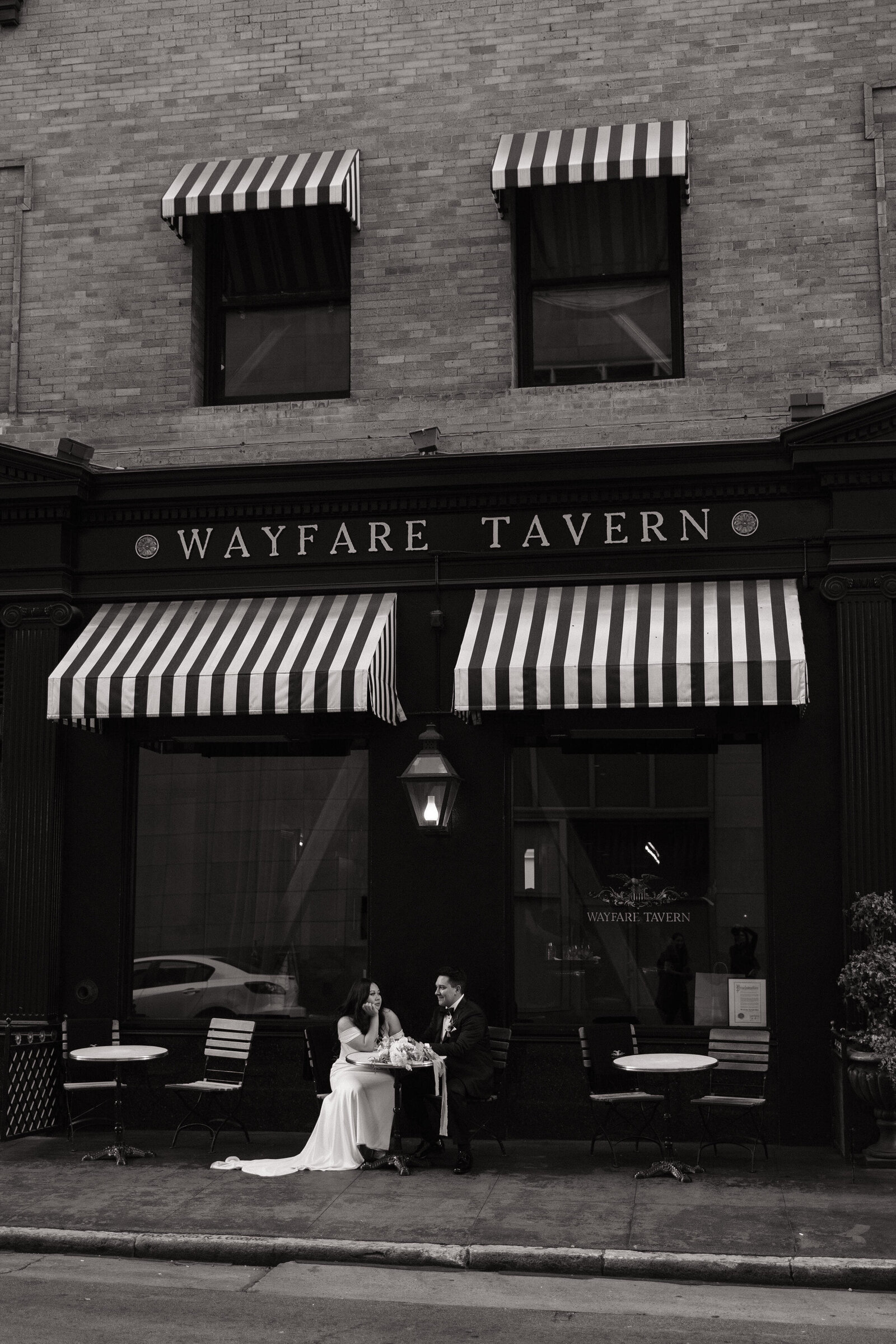 Modern black and white portraits outside tavern during San Francisco wedding reception