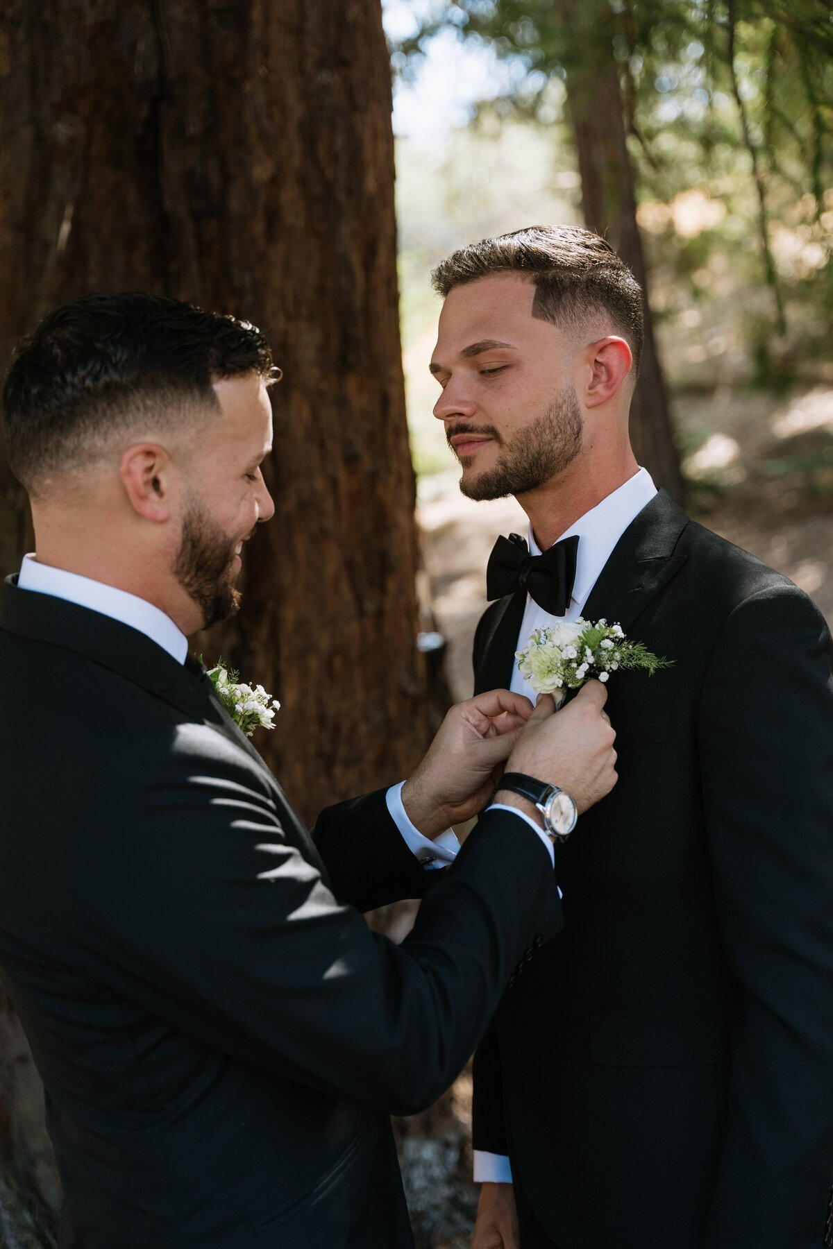 Grooms getting ready at wedding by destination wedding photographer