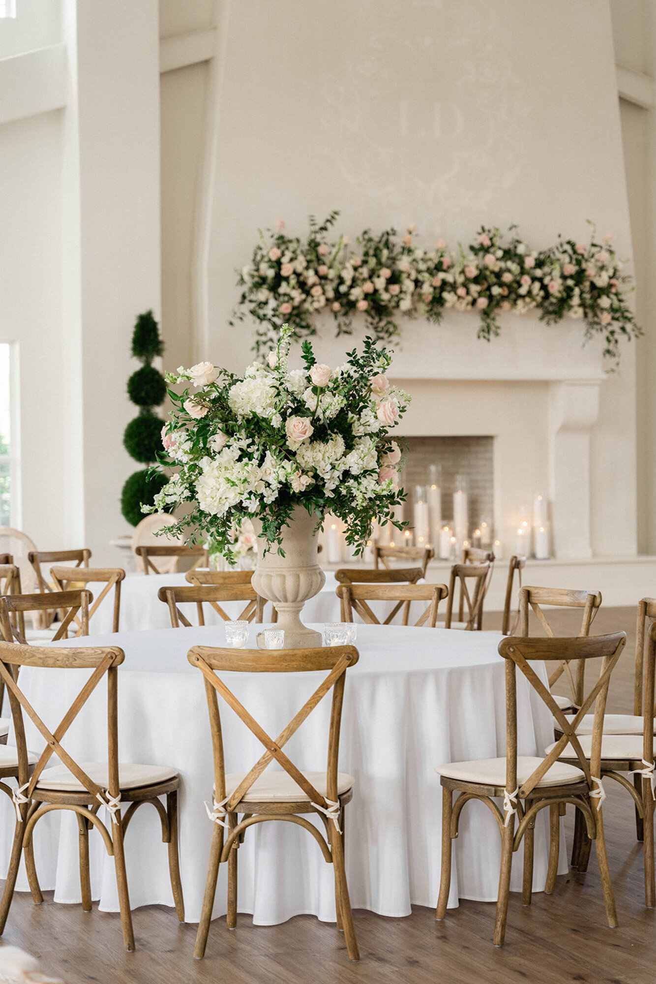 reception design with wooden chairs and florals