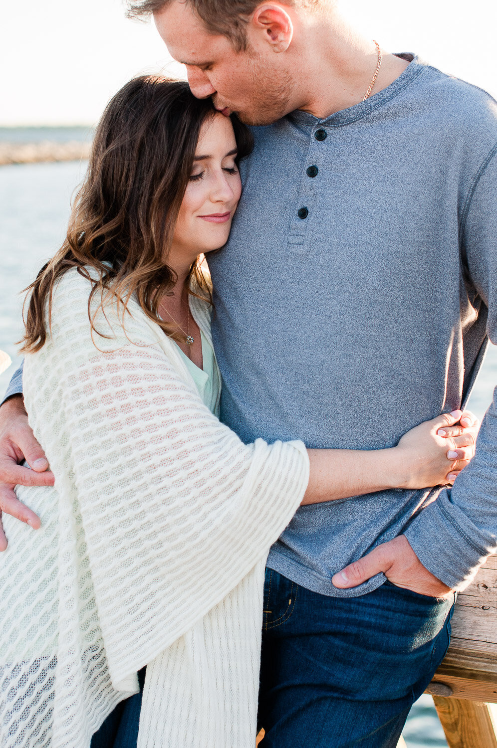 couple embrace and  kiss on forehead