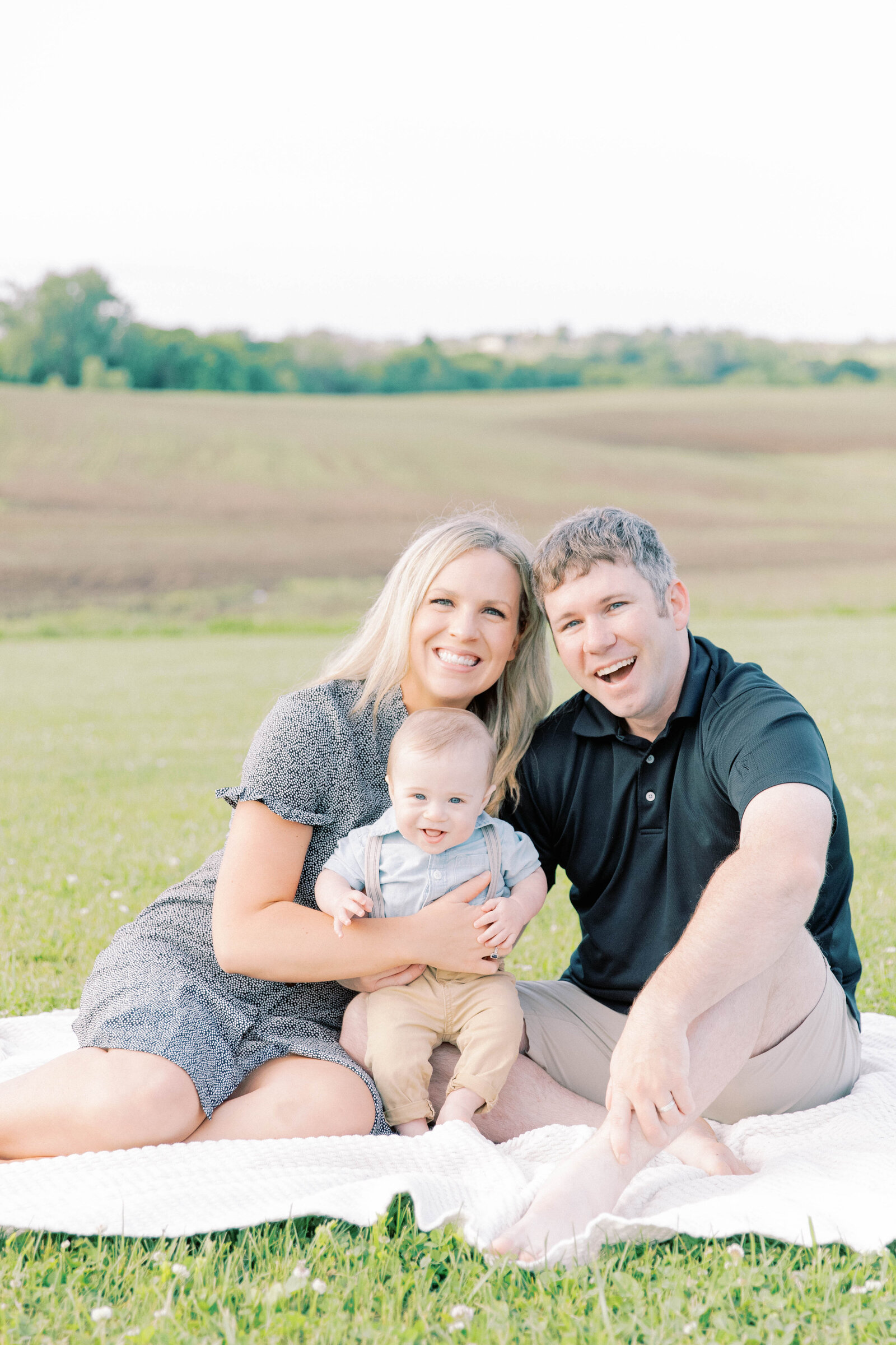 Joyful family sunrise session on family land in Kansas