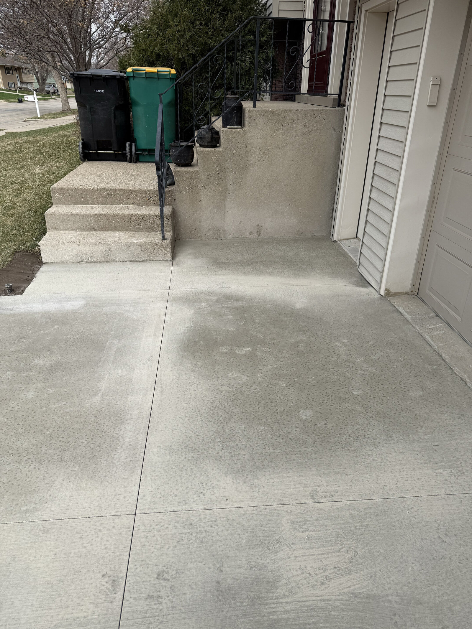 concrete driveway in front of steps