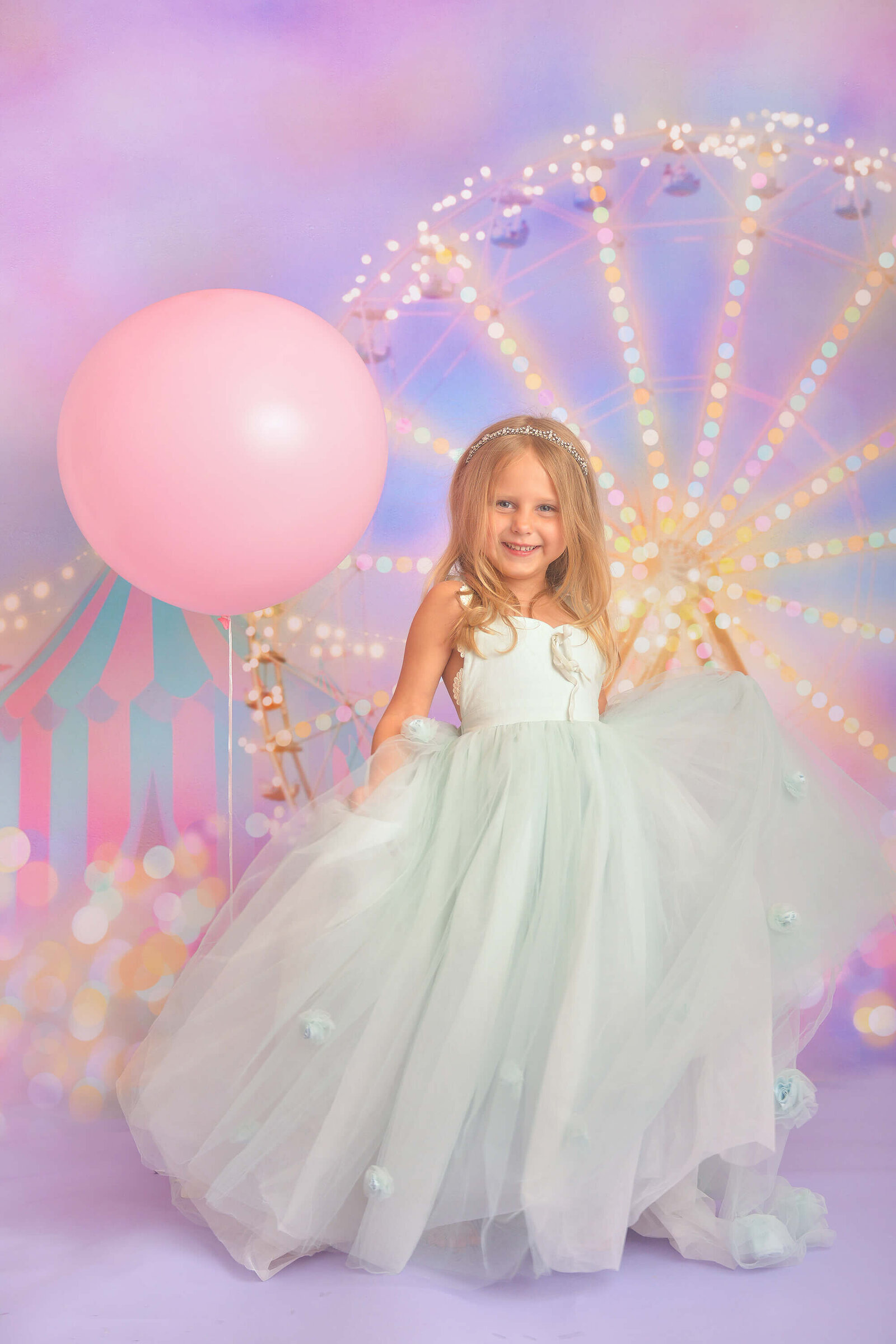 girl smiles while in a beautiful dollcake dress at her photography session