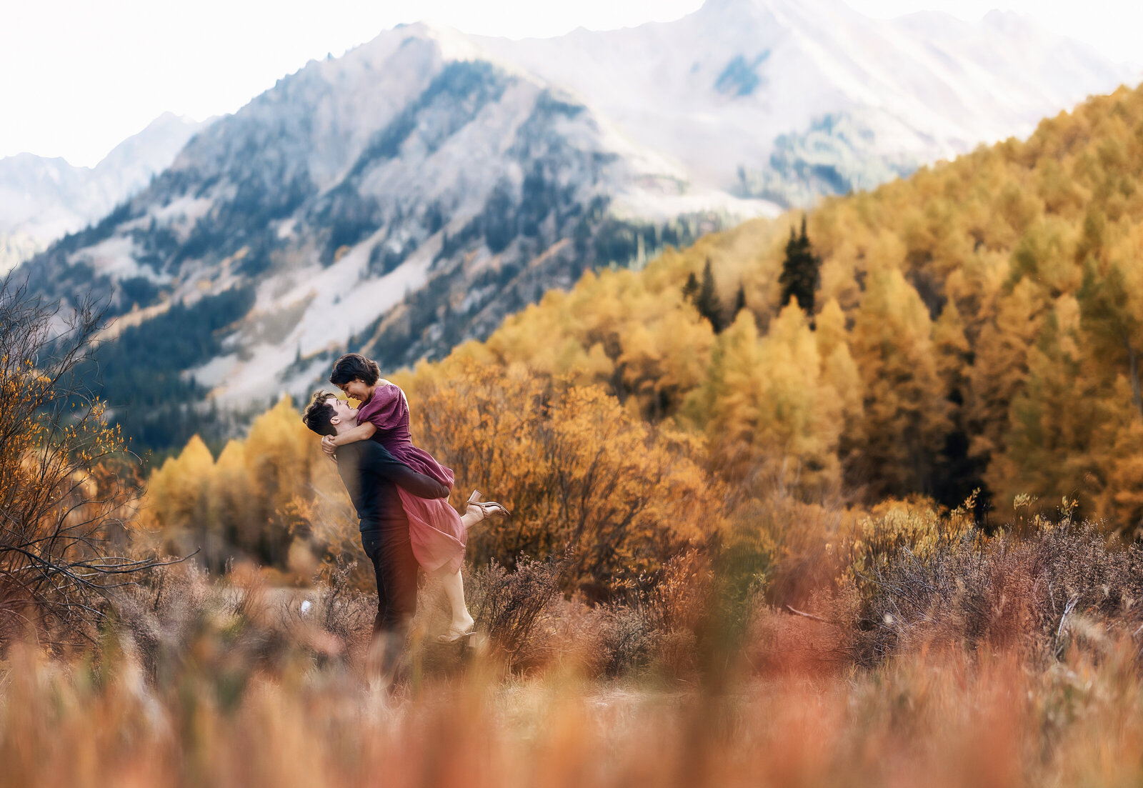 A young couple celebrates their engagement in the bright yellow aspen groves.