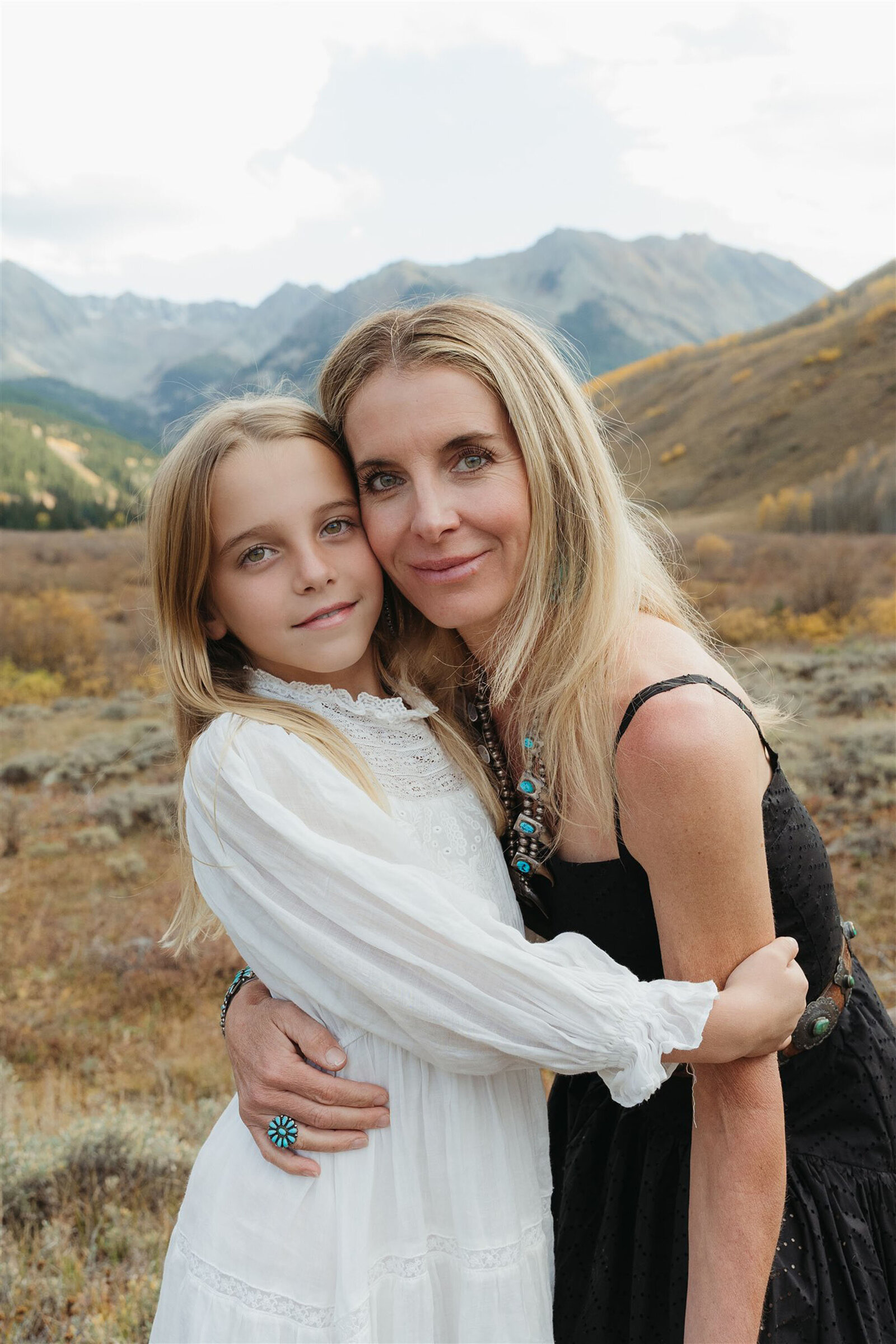 Editorial-style Aspen couples portrait — classic layers and refined textures styled against the Rocky Mountain backdrop.
