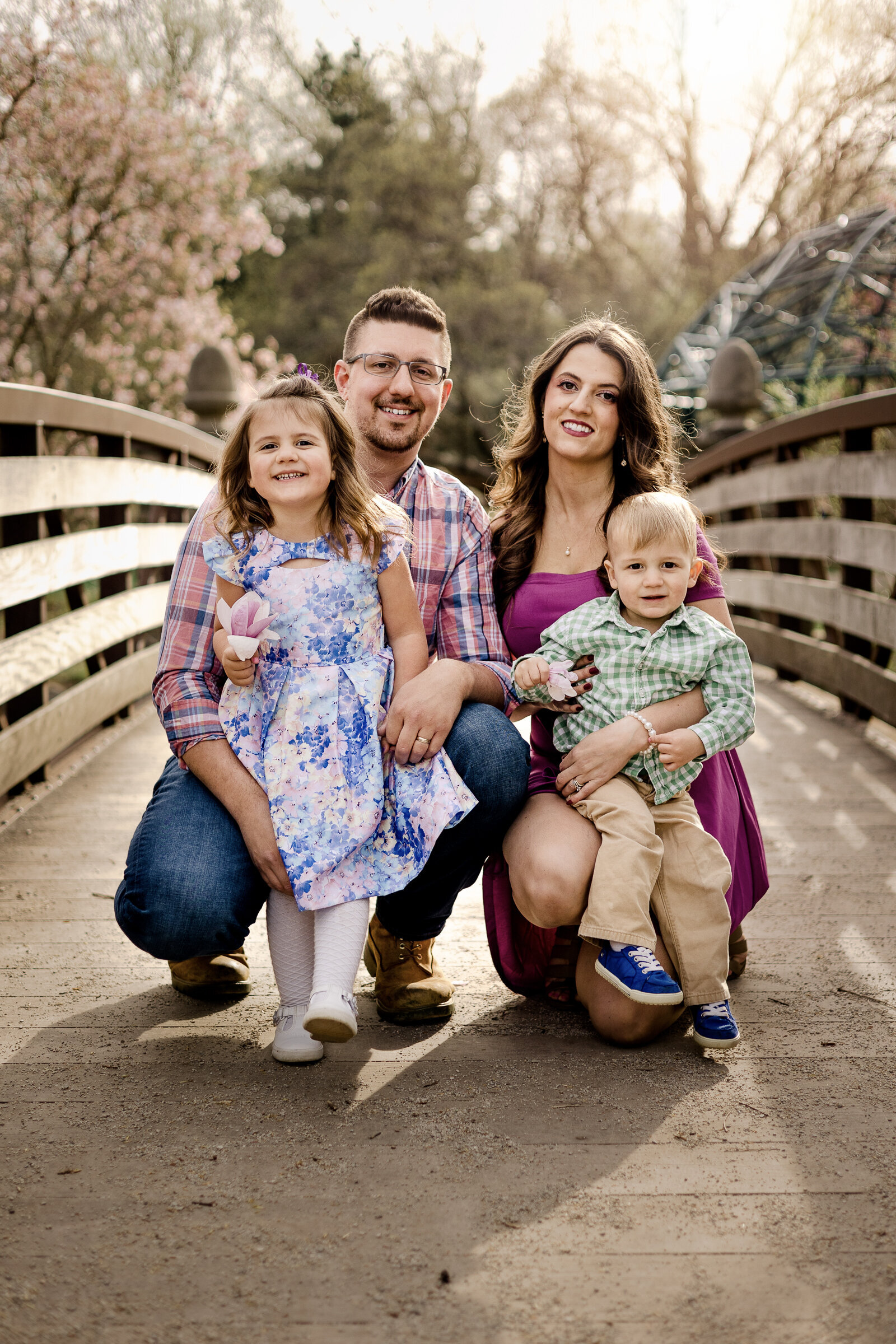 Family of four posing on a bridge at Frontier Park Erie, PA