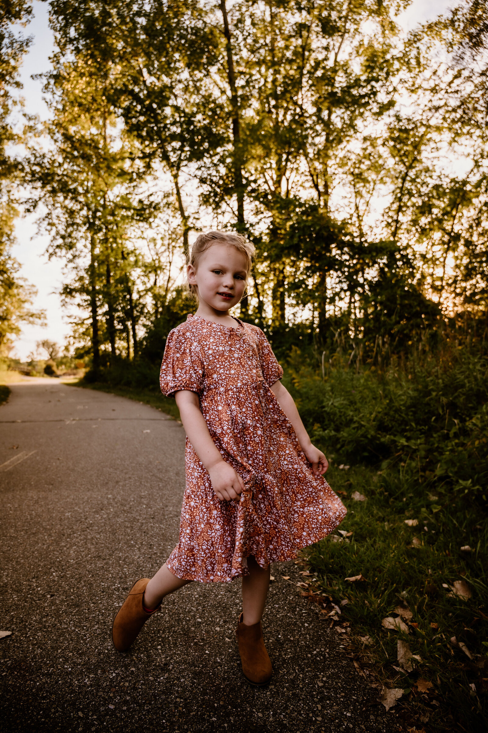 Little girl in michigan fall on a gravel path