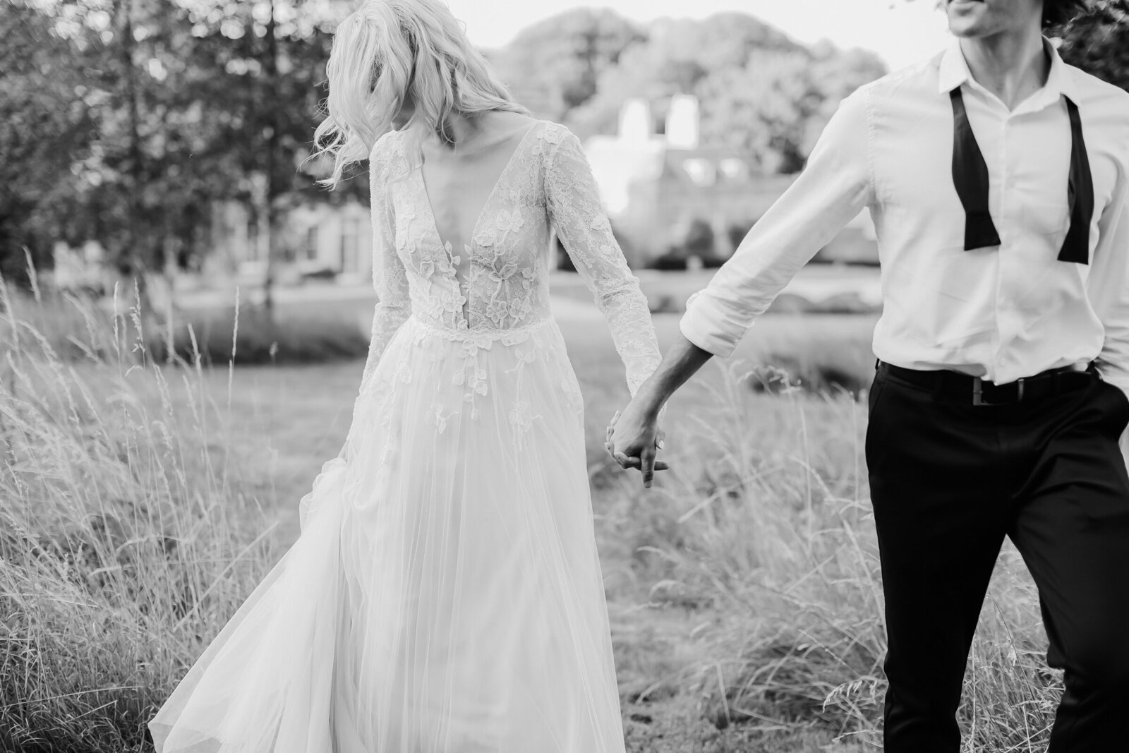 Came-House-Dorset-bride-and-groom-holding-hands
