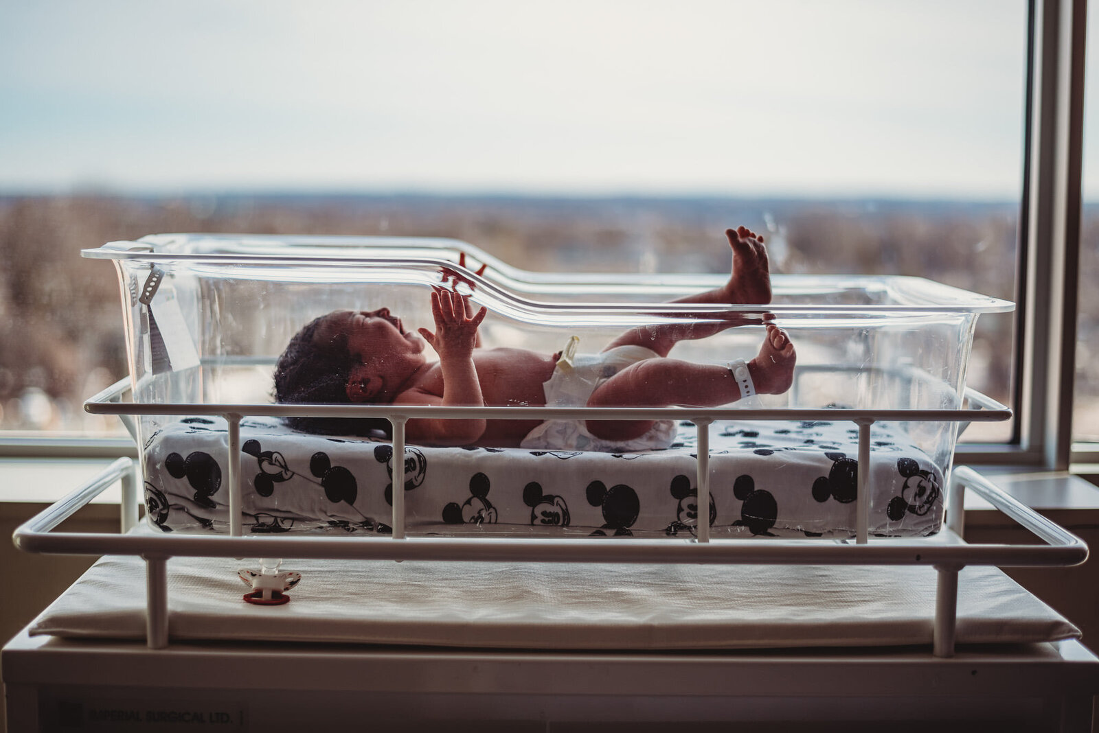 Newborn baby in a hospital bassinet at Peterborough Hospital