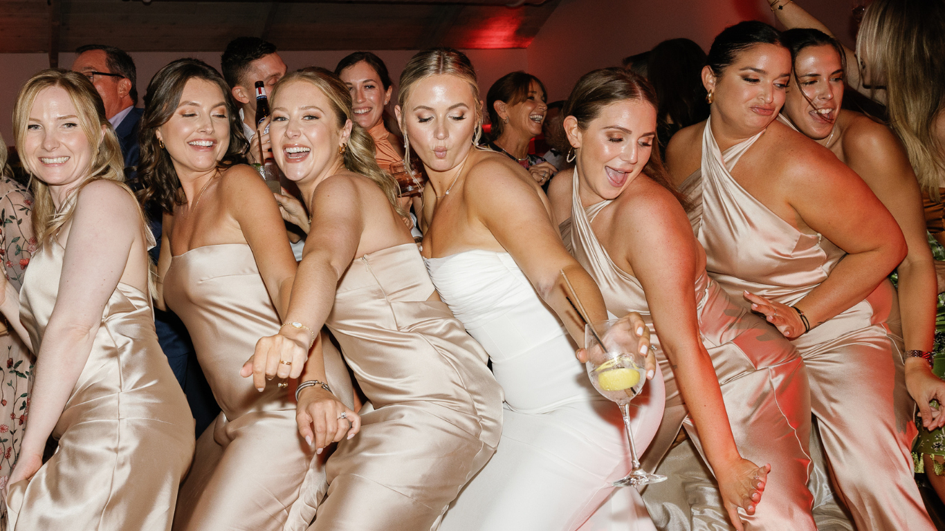 Bridesmaids enjoying the wedding party at Baker's Cay, captured by Claudia Amalia Photography, a Miami-based wedding photographer.