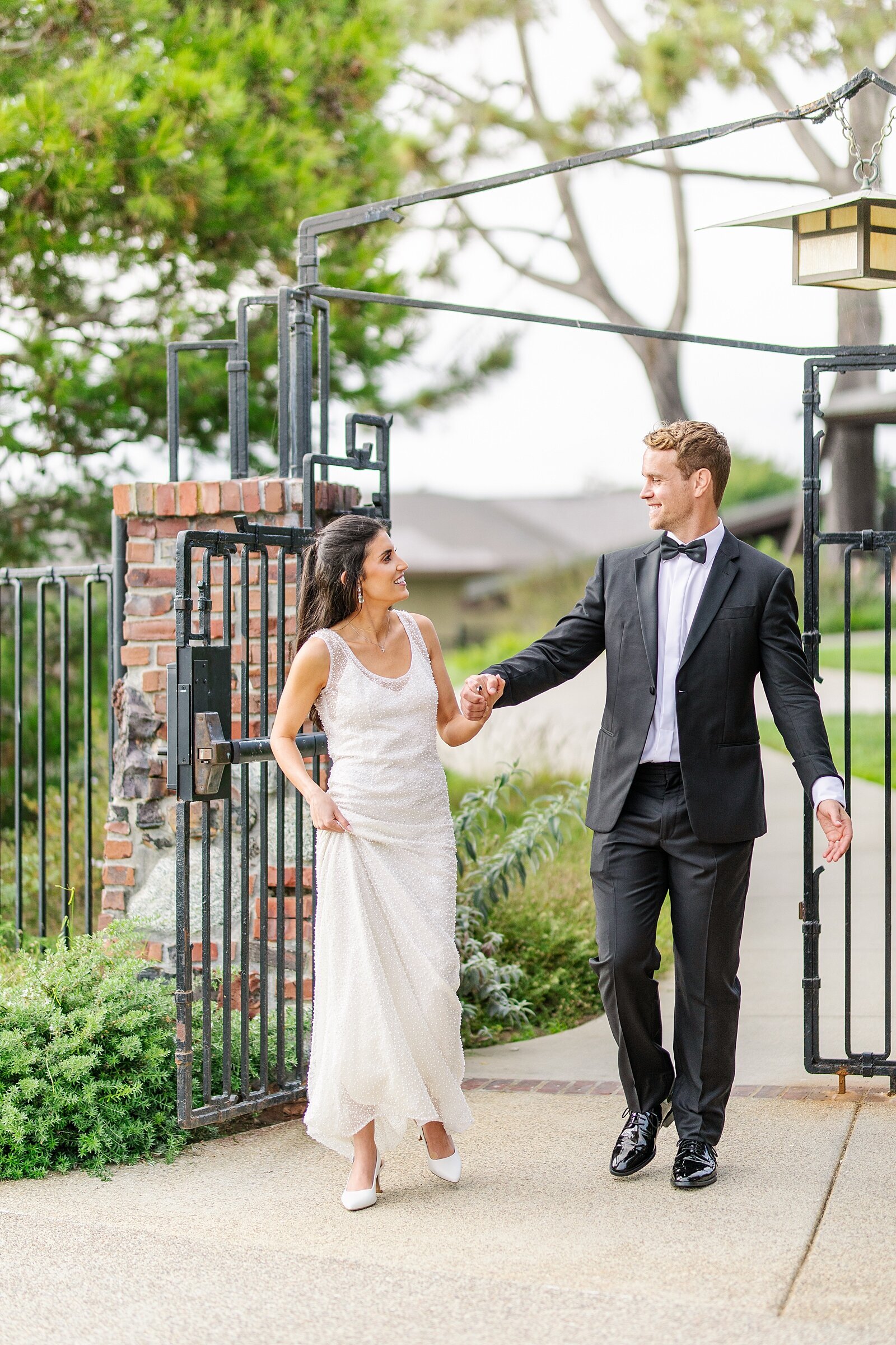 Bride and groom entering their reception at The Lodge at Torrey Pines.