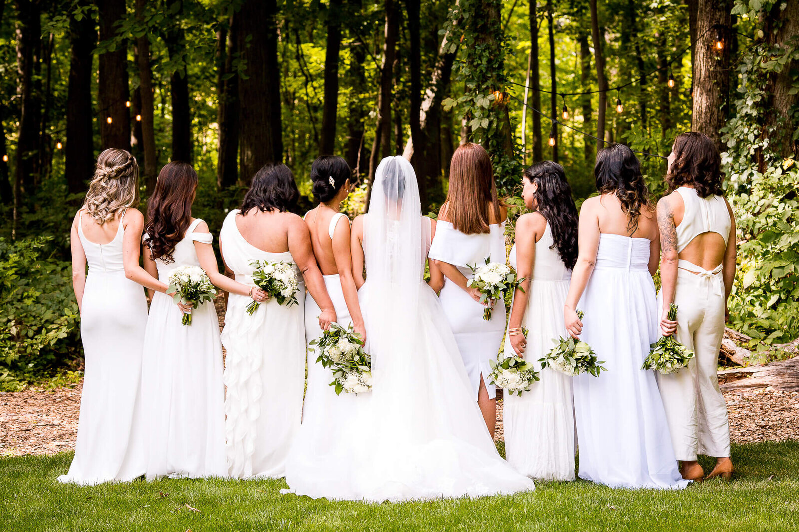 Bride with bridesmaids in white dresses.