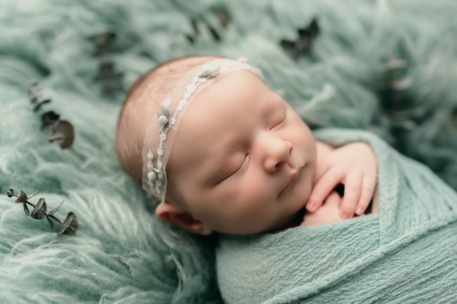 baby picture, girl in swaddled in teal