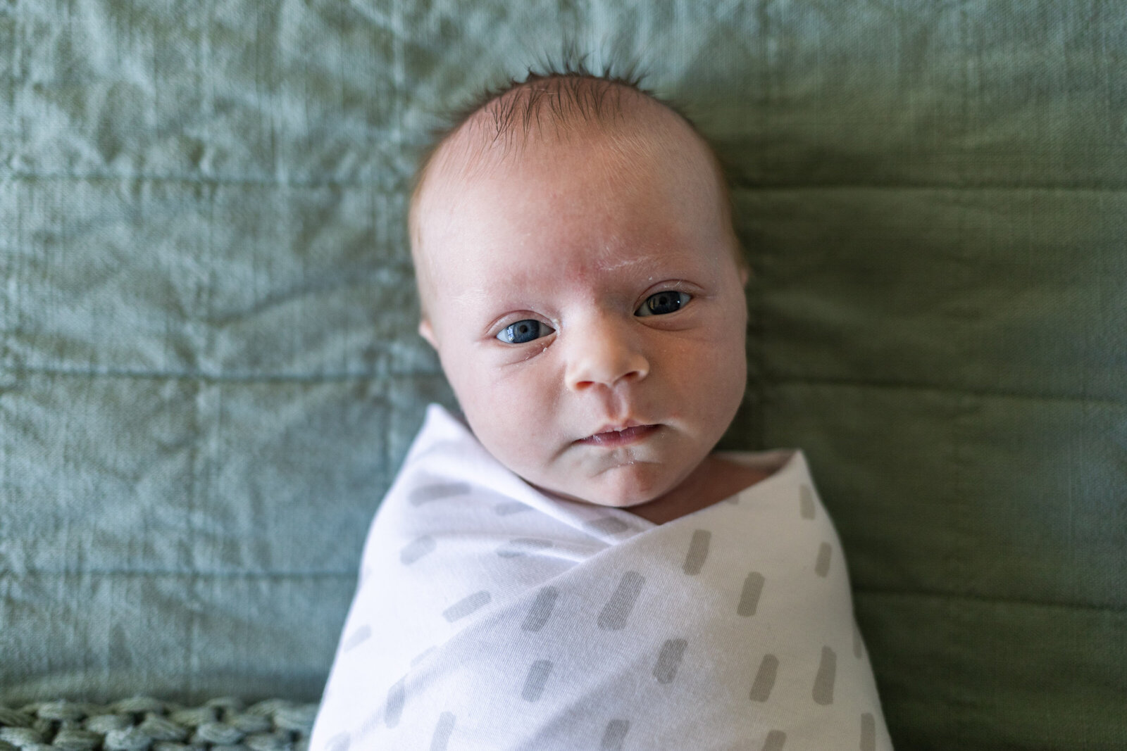 Kansas_City_Newborn_Photography_baby_looking_swaddled-14