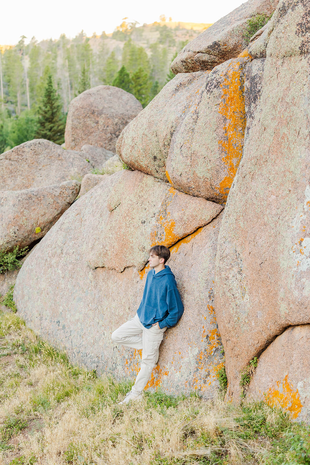Boy posing for his high school senior session at Vedauwoo near Laramie, Wyoming.
