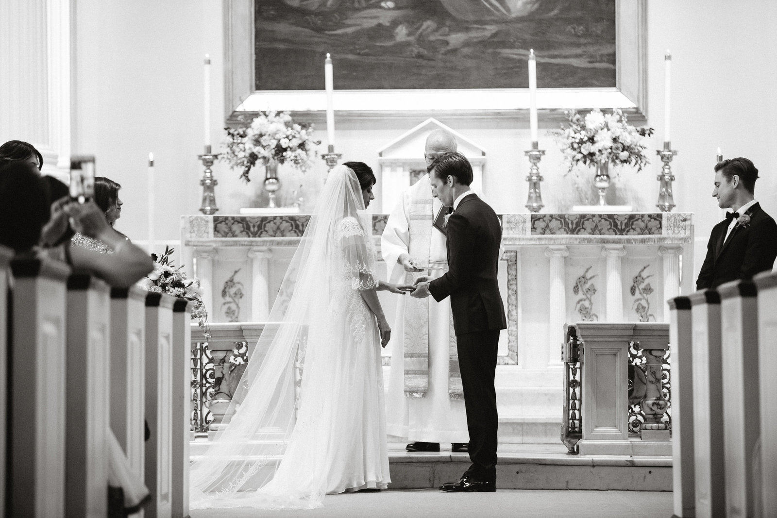 Bride and groom exchanging vows at their church wedding ceremony in Philadelphia.