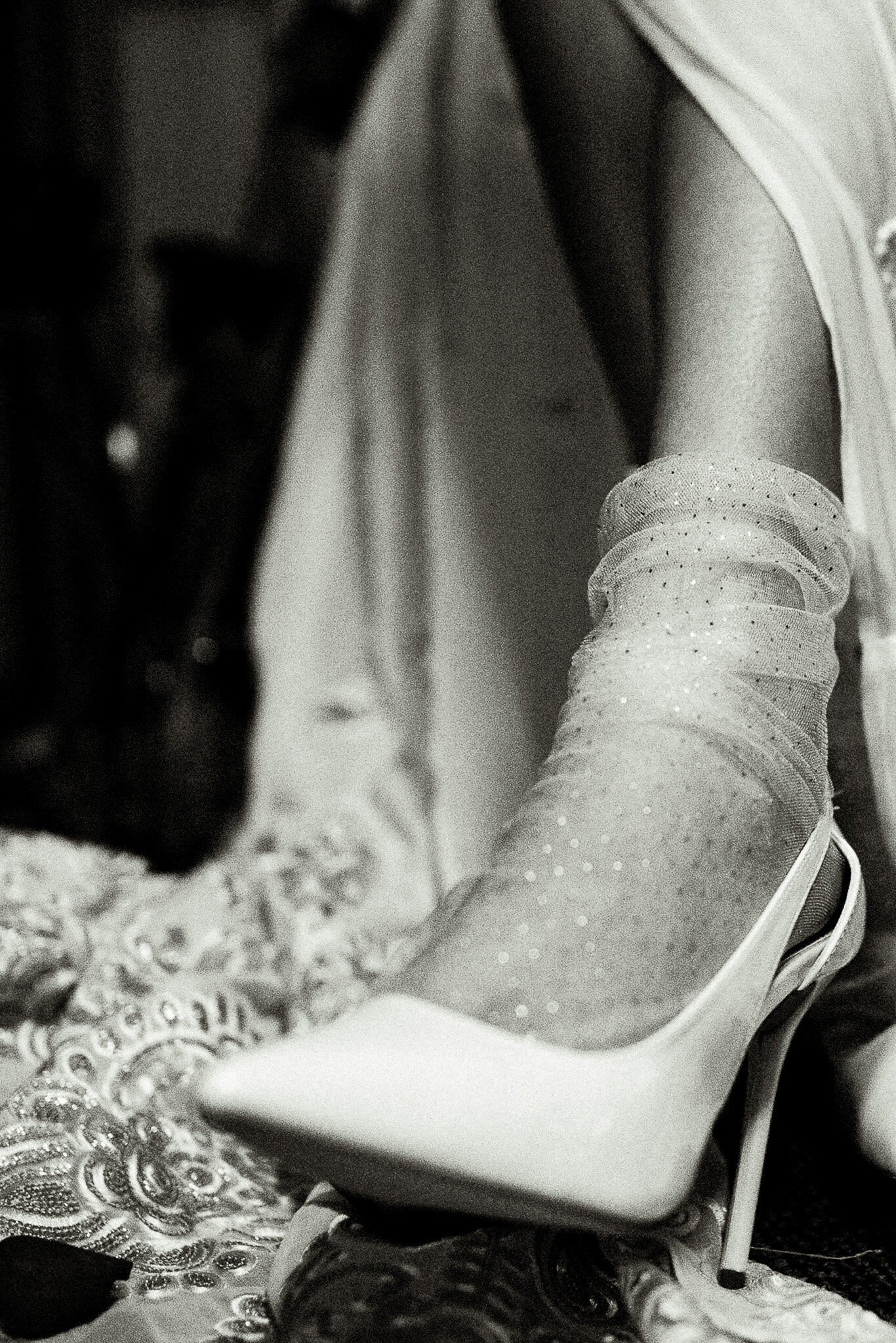 Bride wearing nylon stocking and bridal shoes