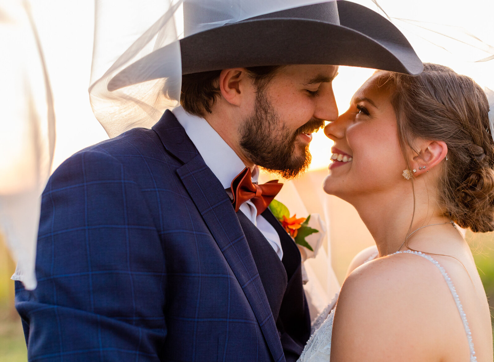 bride and groom about to kiss