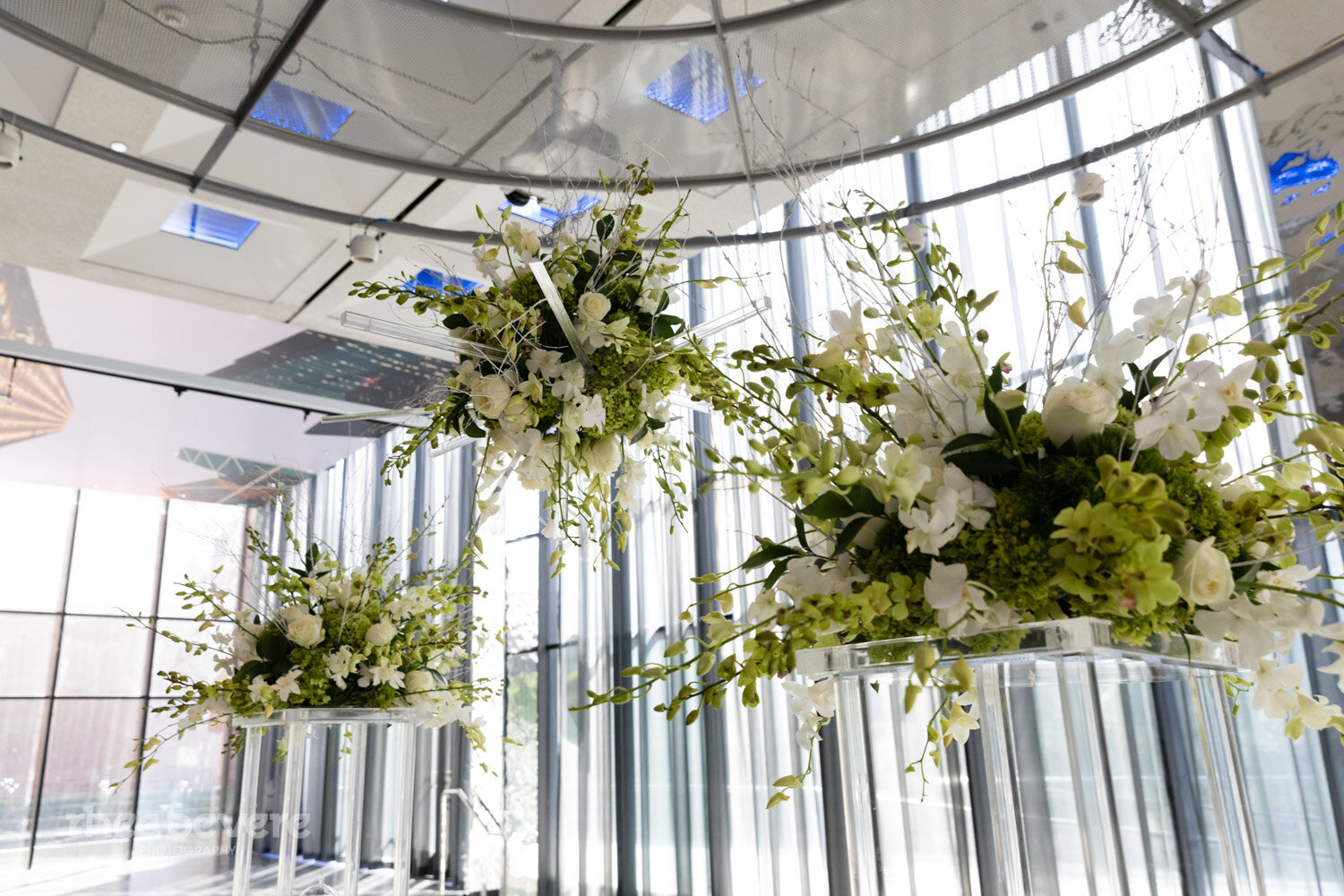 Modern wedding hanging floral arrangements with orchids