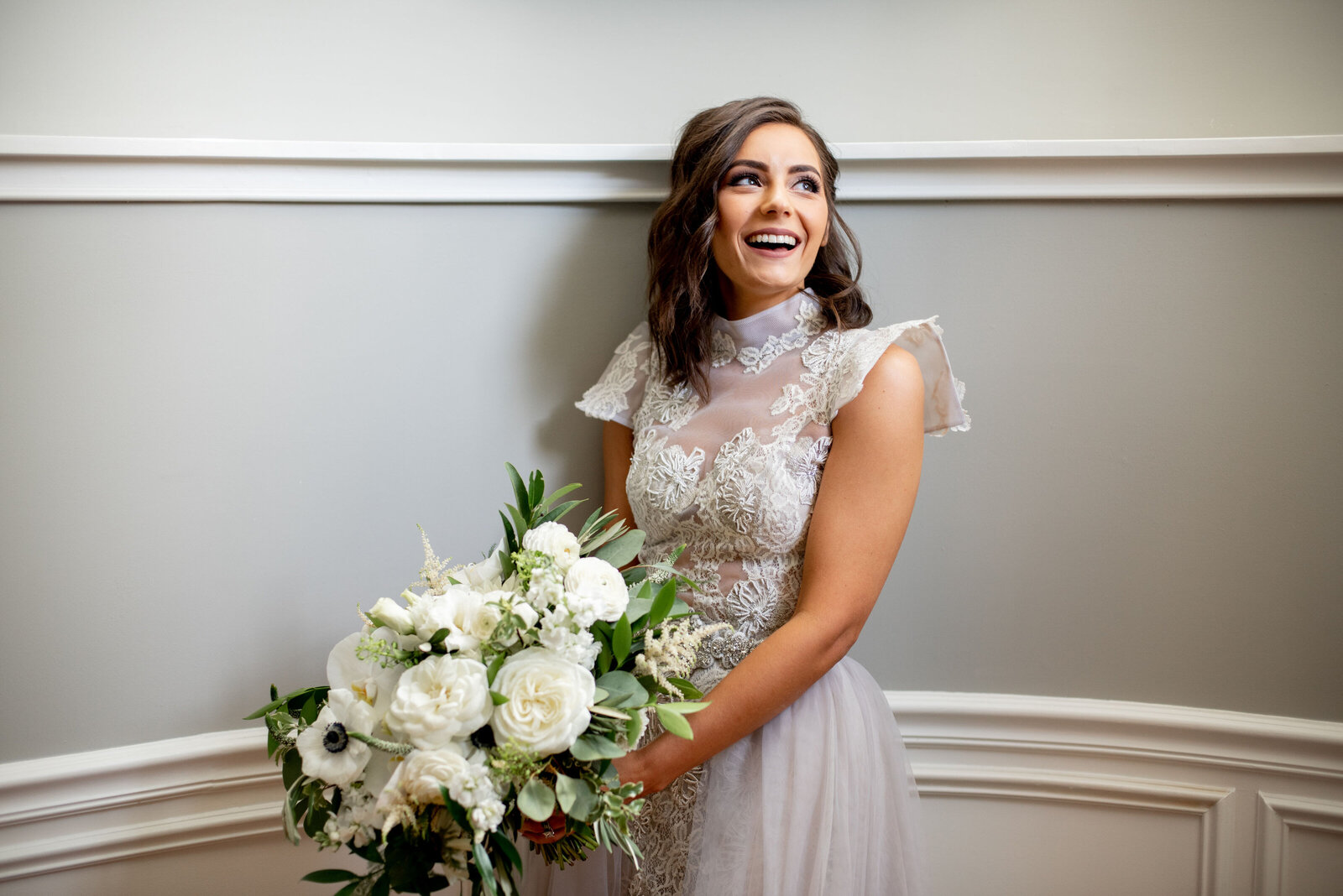Bride with green and white bouquet
