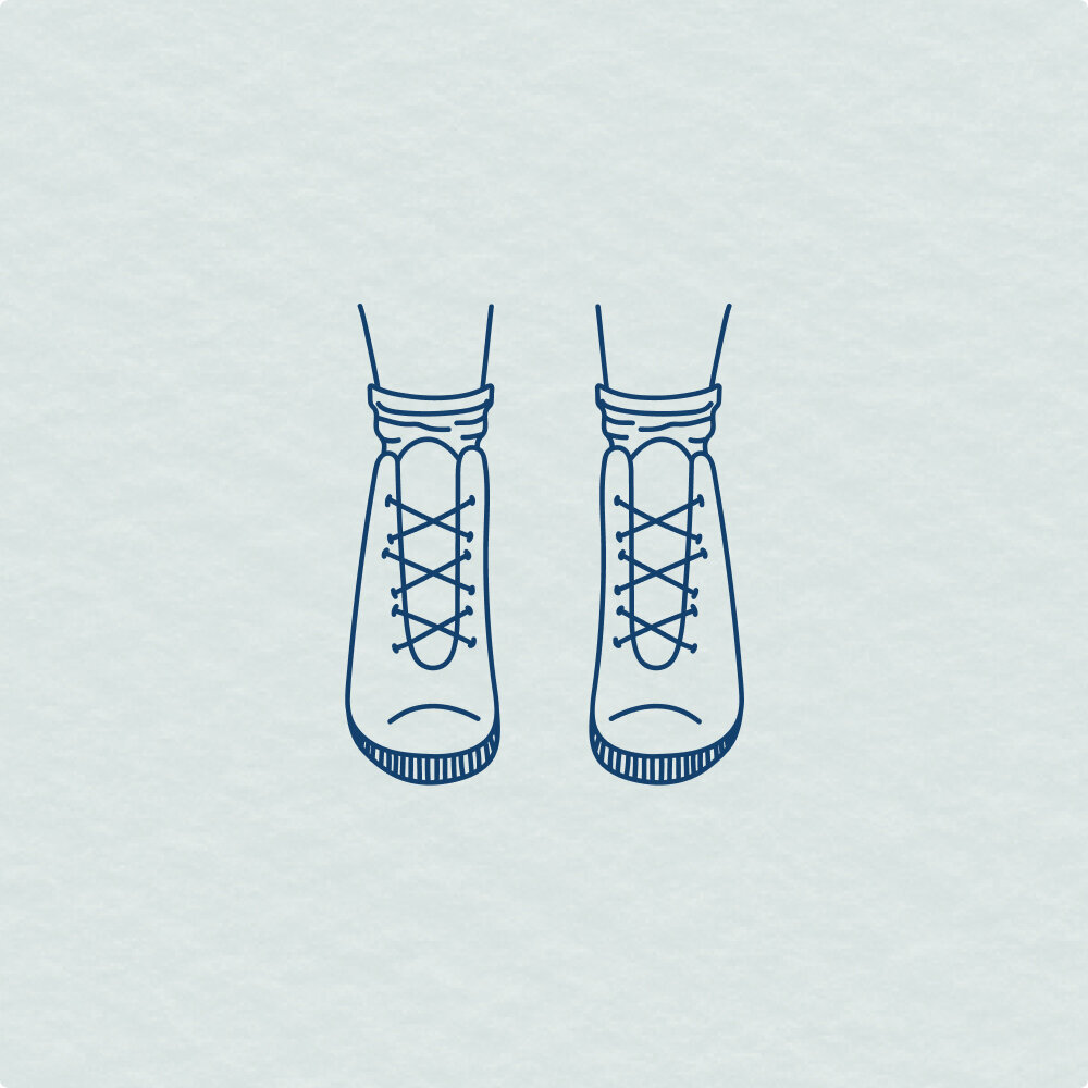 Illustration of feet in a pair of hiking boots.