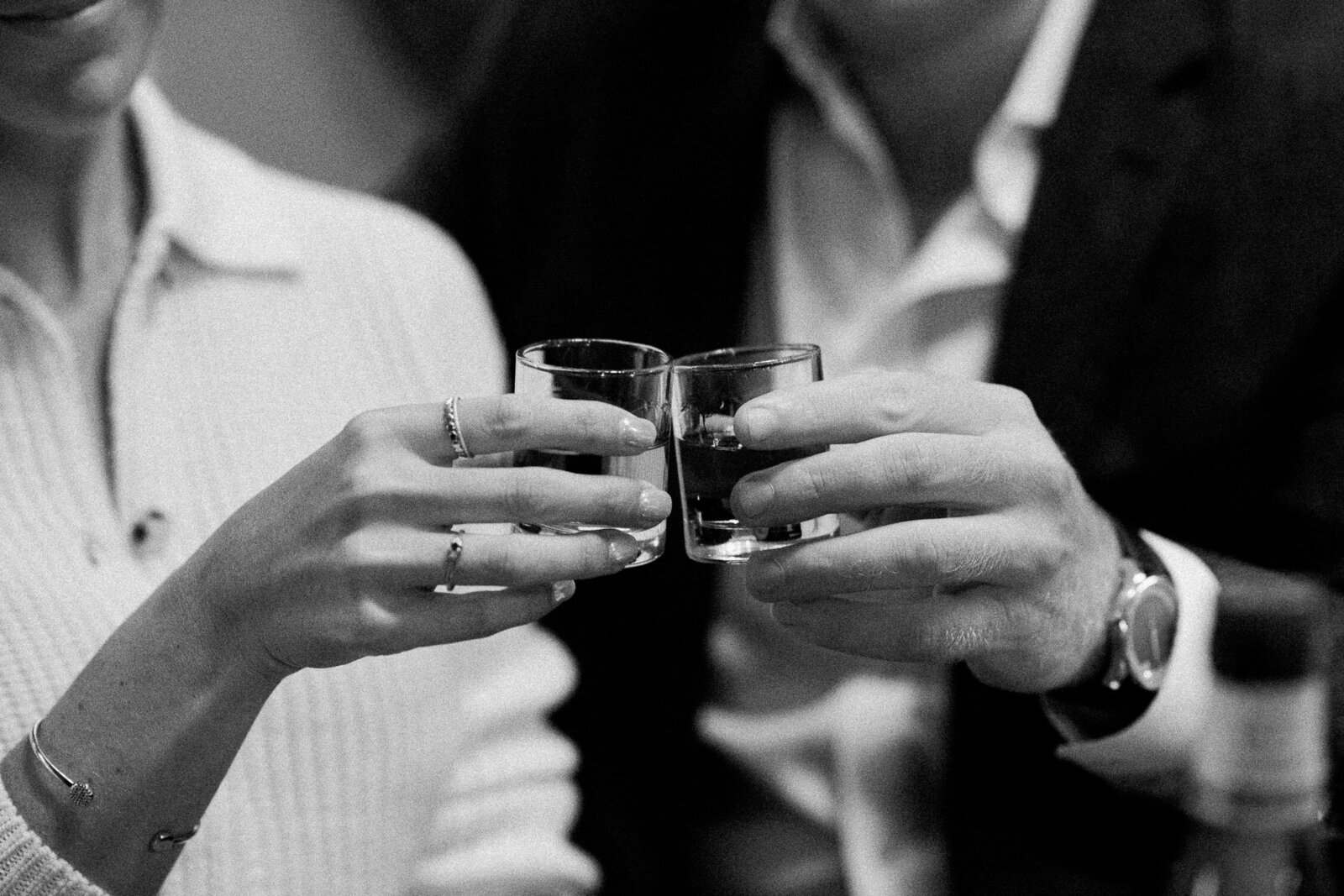 cheers with shot glasses