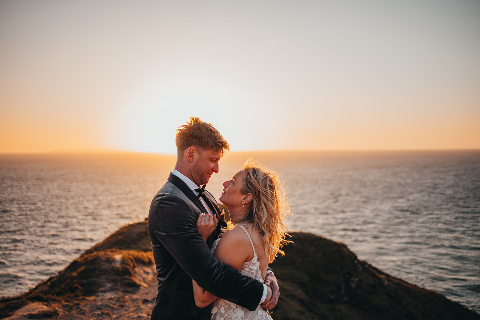 eloping couple on sunset cliffs