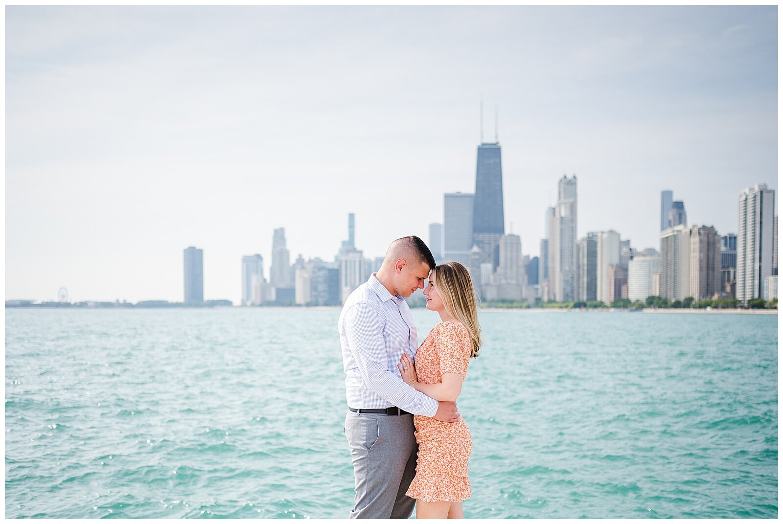 Bright and airy engagement portrait at North ave beach overlooking the Chicago skyline.