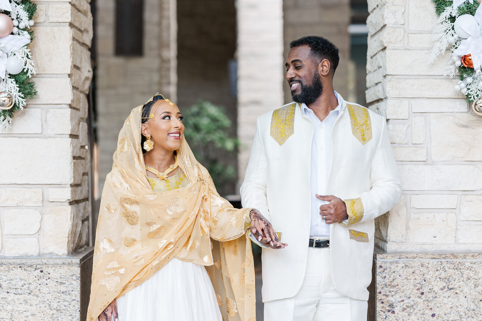 Groom-and-bride-looking-at-eachother-smiling