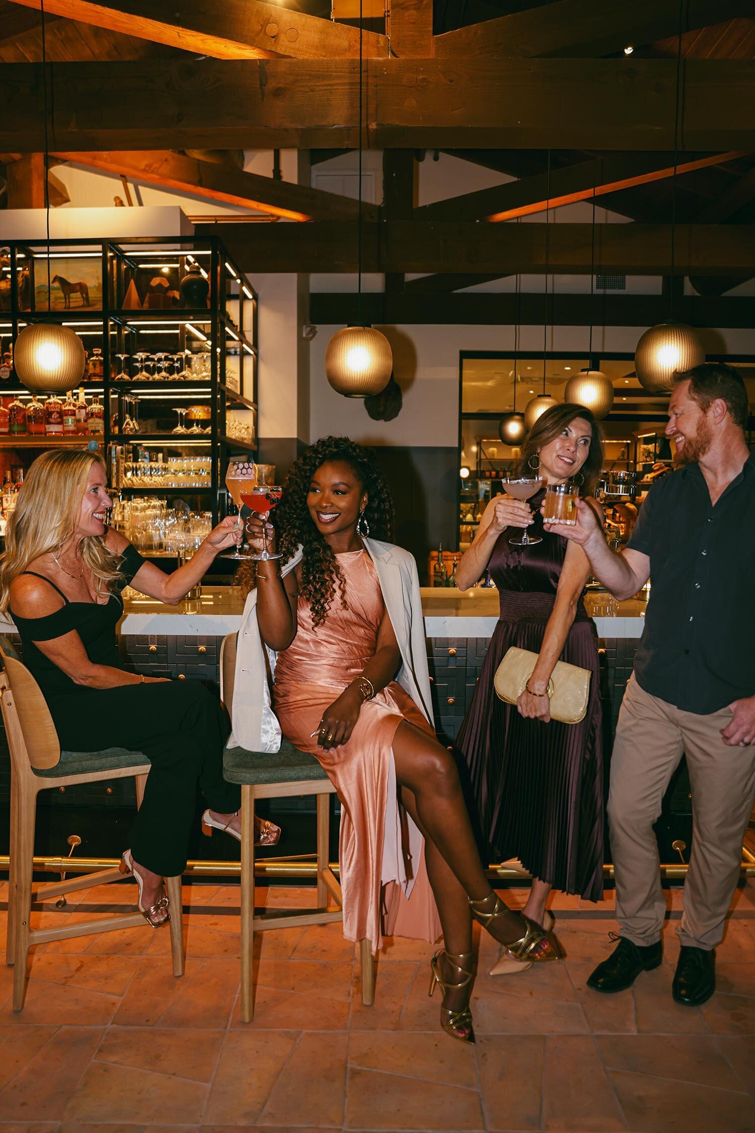 lifestyle hotel photography people drinking cocktails at bar