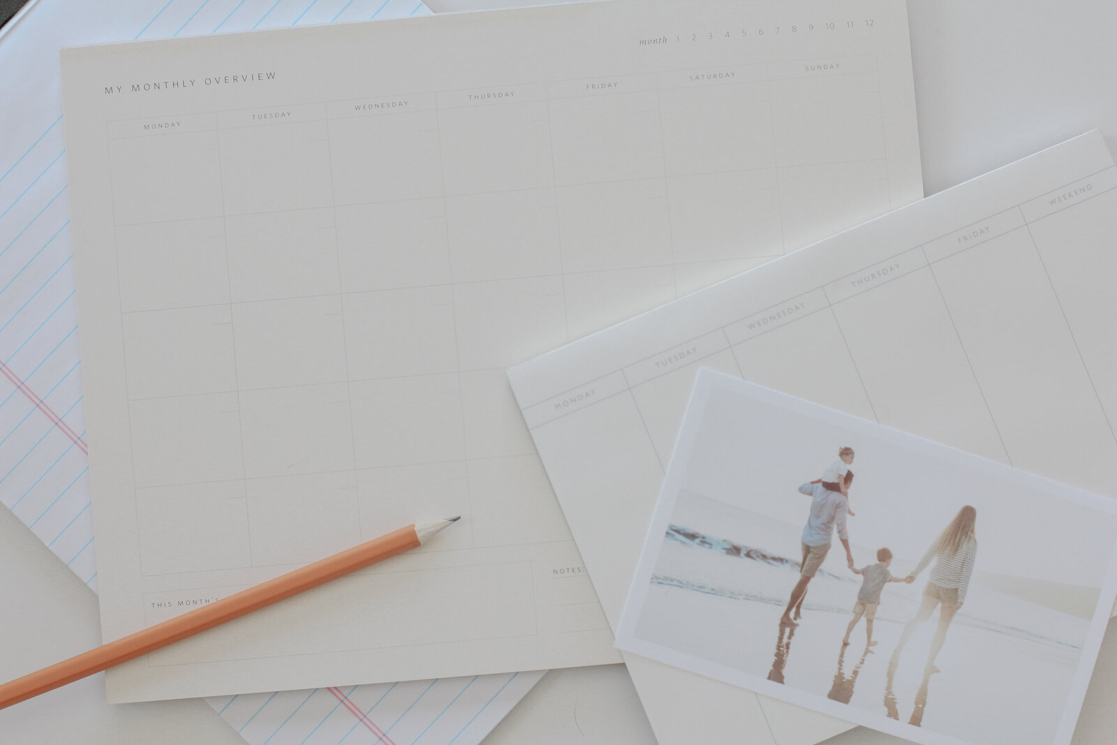 Calendar with pencil and photographs