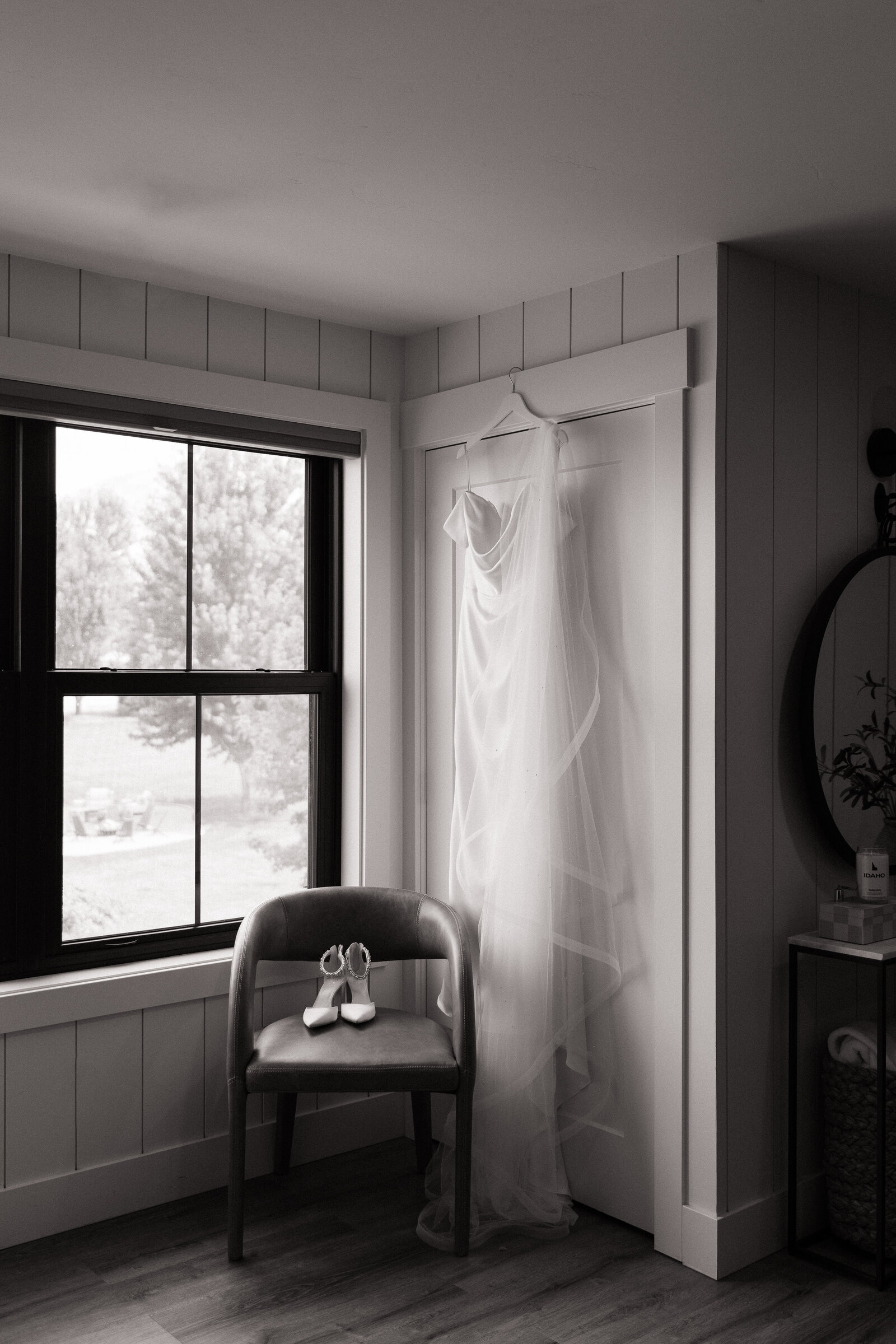 Bride's dress hanging for detail photos at White Barn Weddings in Emmett, Idaho