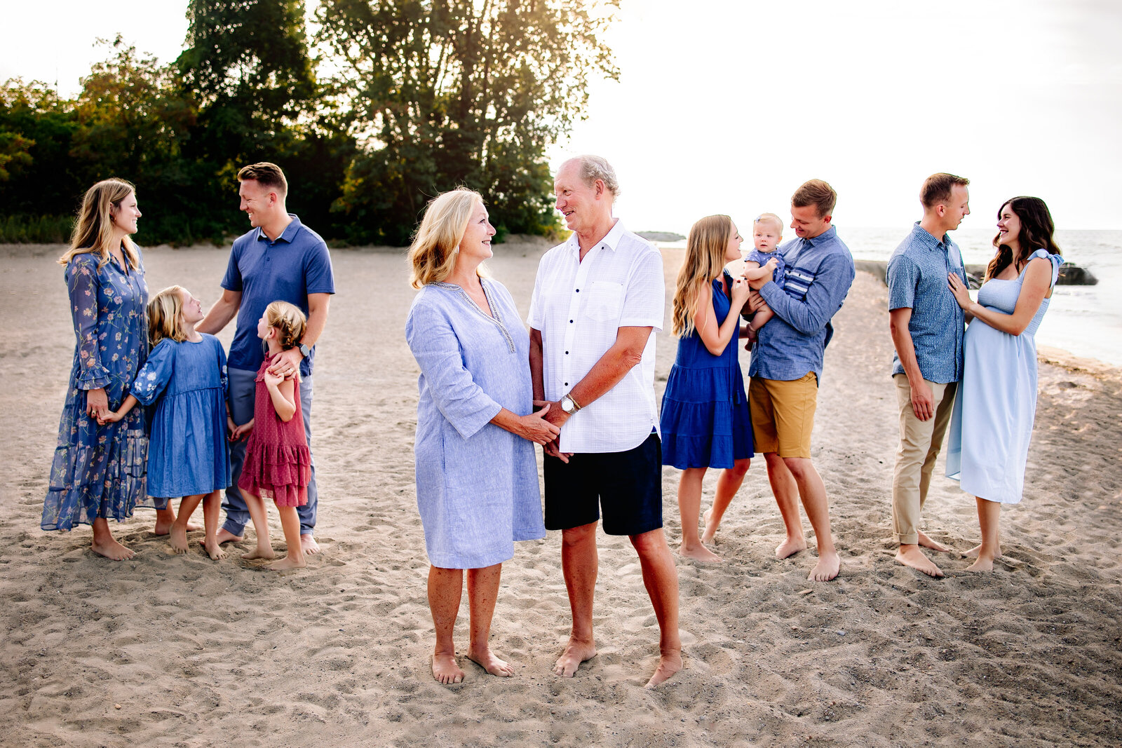 Multi generational family stands together along the sands of Presque Isle beach