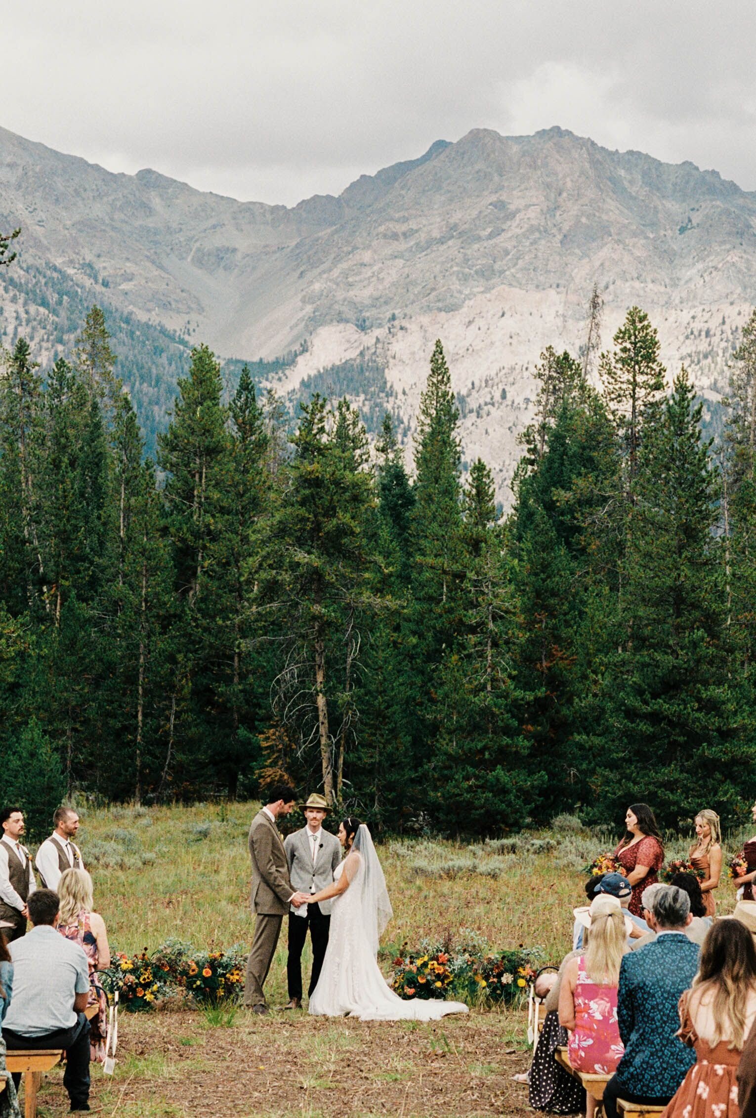 Bride and groom exchanging vows at a outdoor wedding ceremony in Idaho