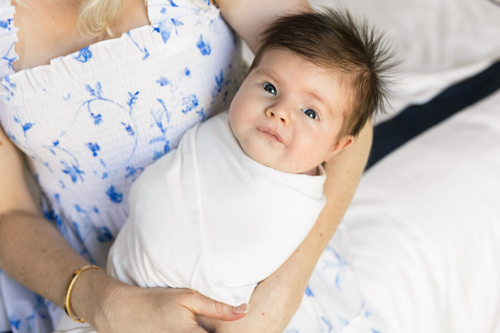 closeup of newborn baby with eyes open