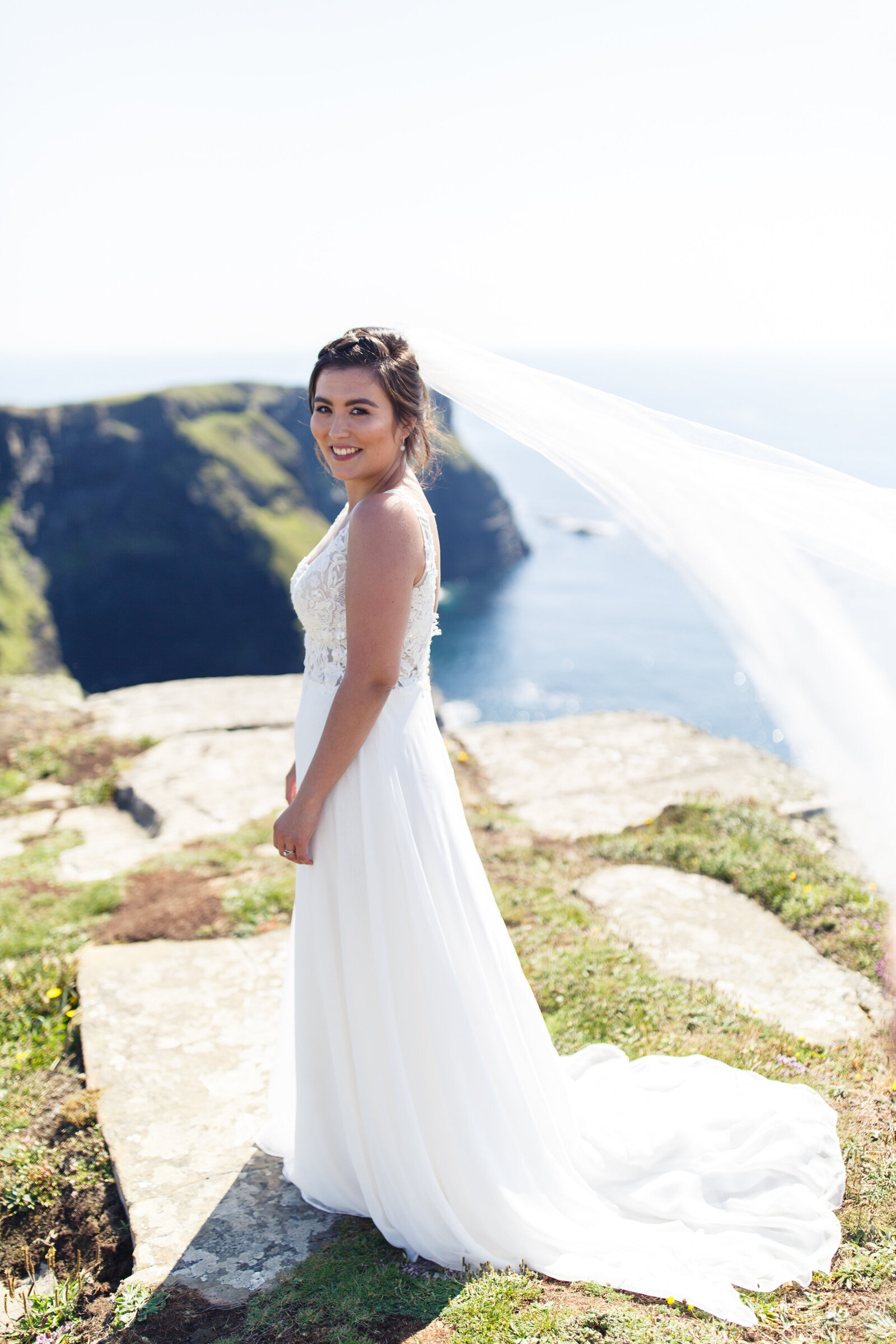 bride standing on the cliffs of moher at hags head