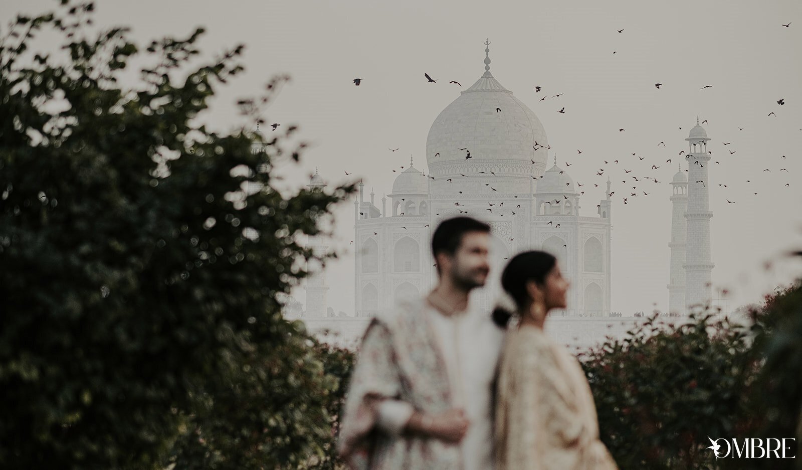 CREATIVE PRE WEDDING PHOTO TAKEN IN FRONT OF TAJ MAHAL AGRA BY TEAM OMBRE