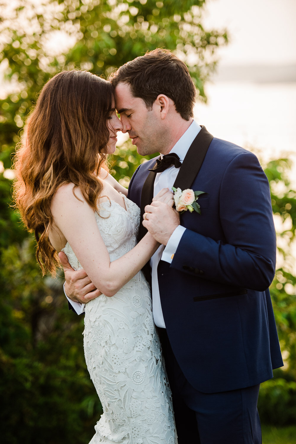 bride and groom romantic embrace at sunset