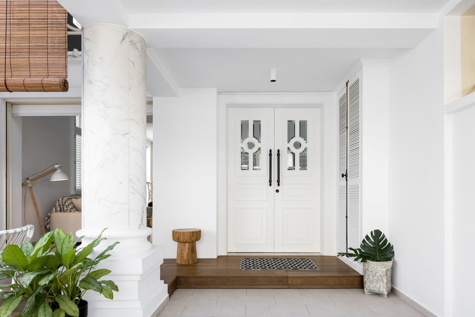 White front door with plants