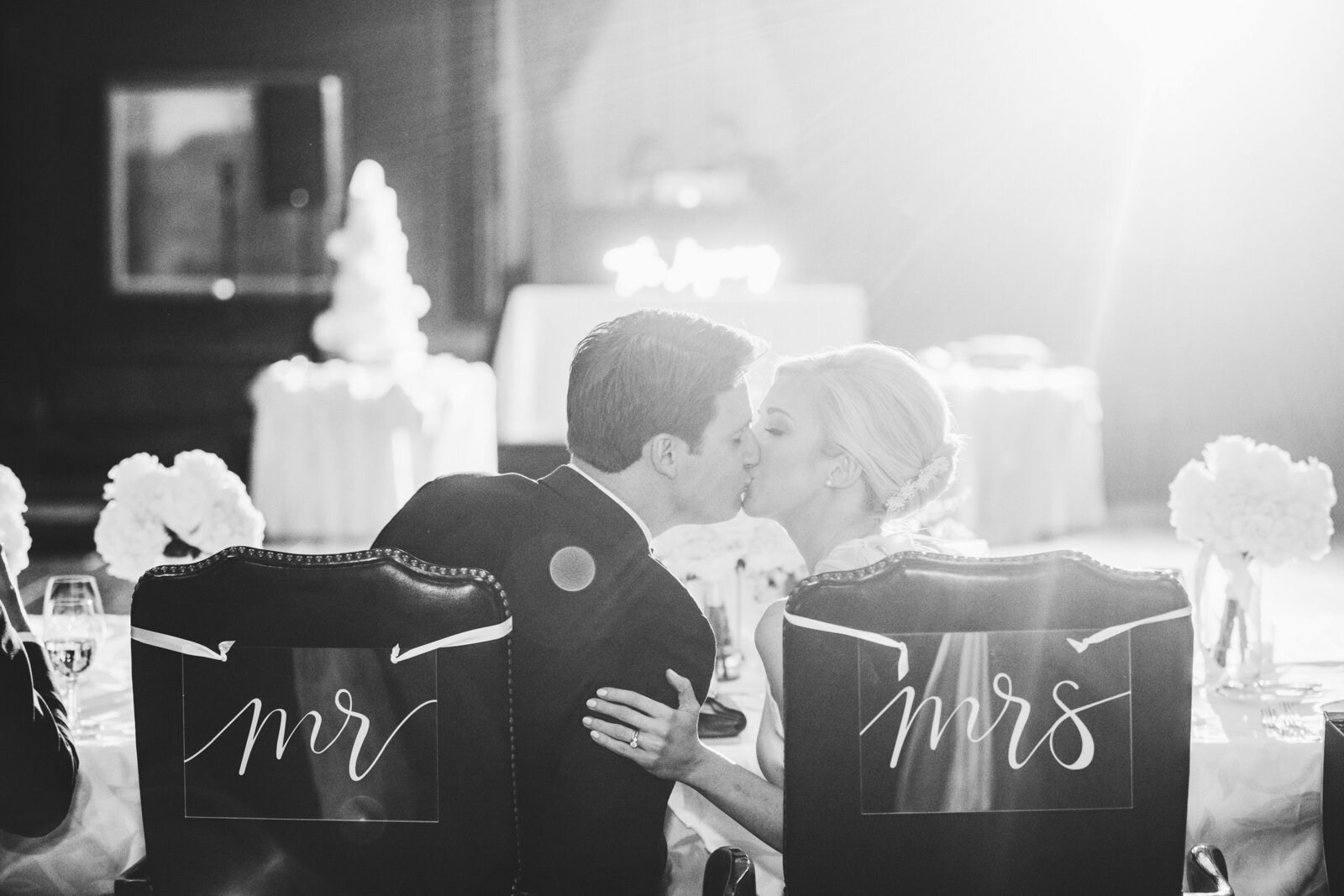 black and white image of couple kissing