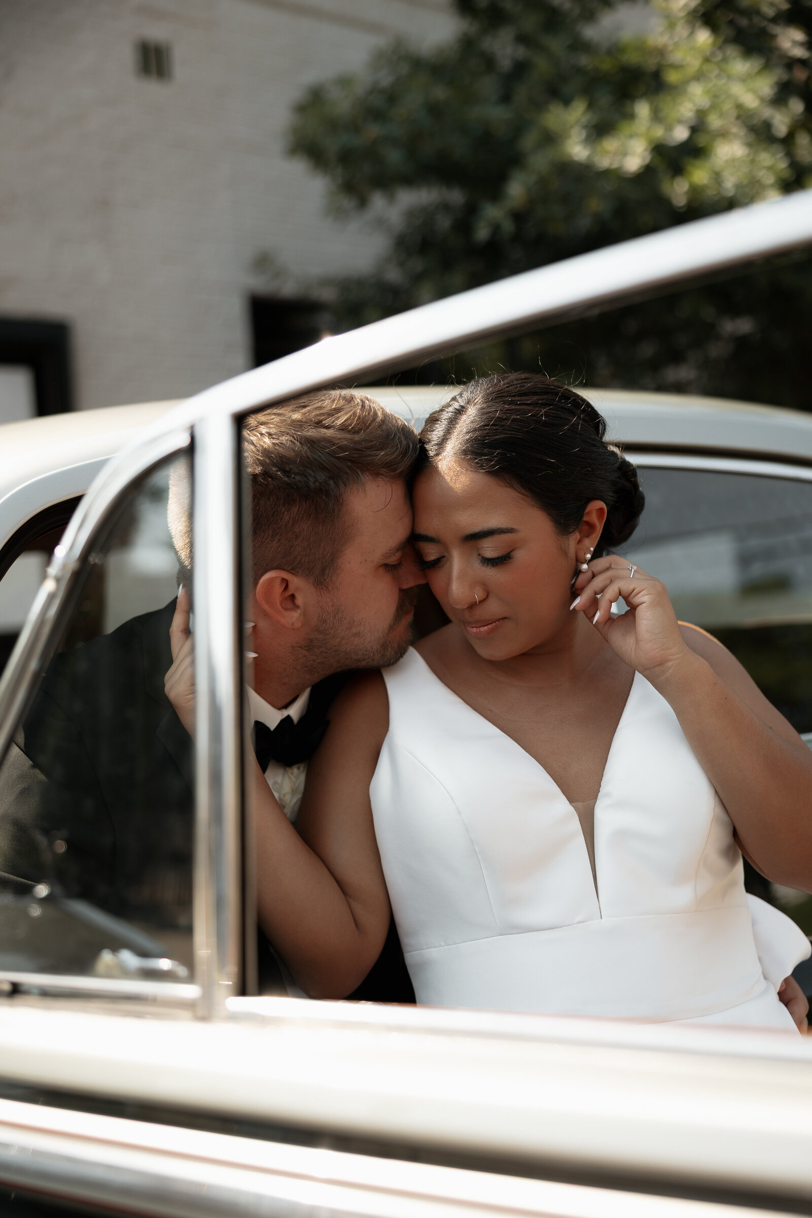 Wild Carrot wedding venue in St. Louis, Mo  editorial couples portrait in an old vintage car
